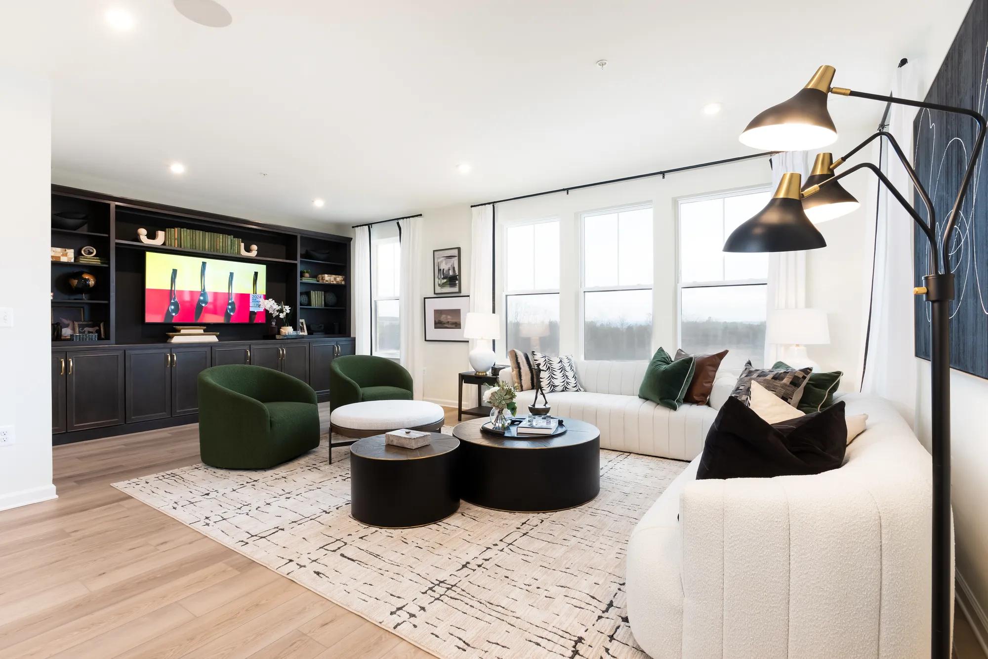 New construction townhome family room with built in shelves and dark wood cabinets