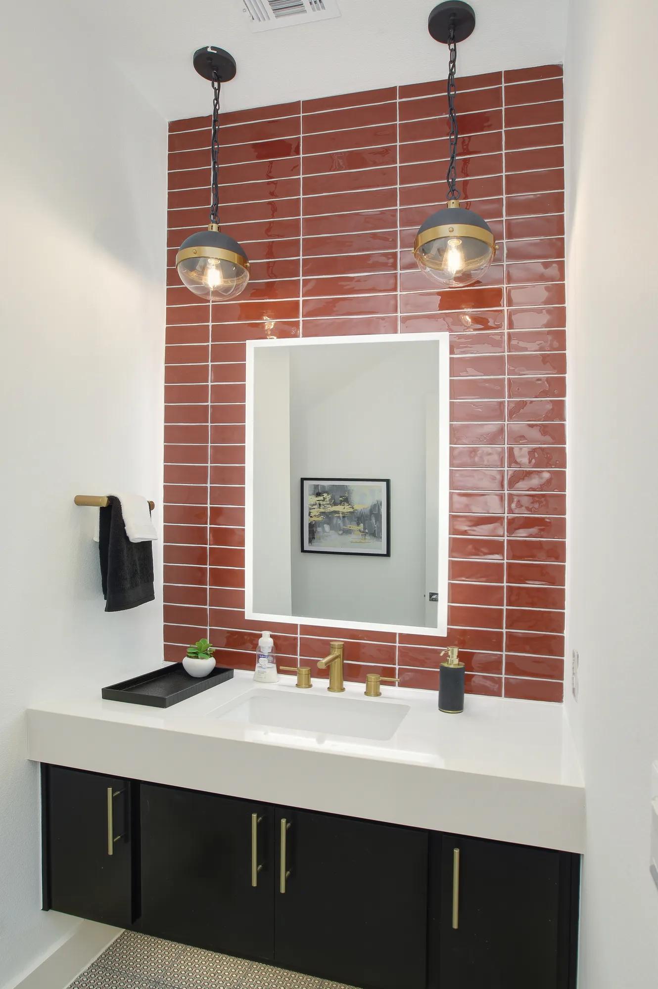 half bath with red tile wall