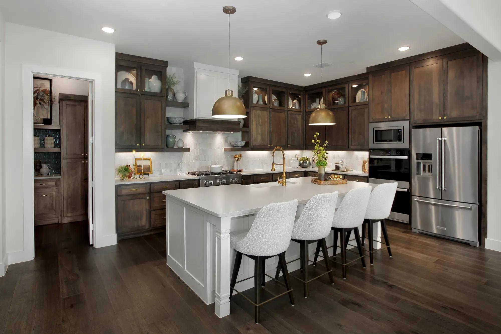 custom new home kitchen with dark wood cabinets