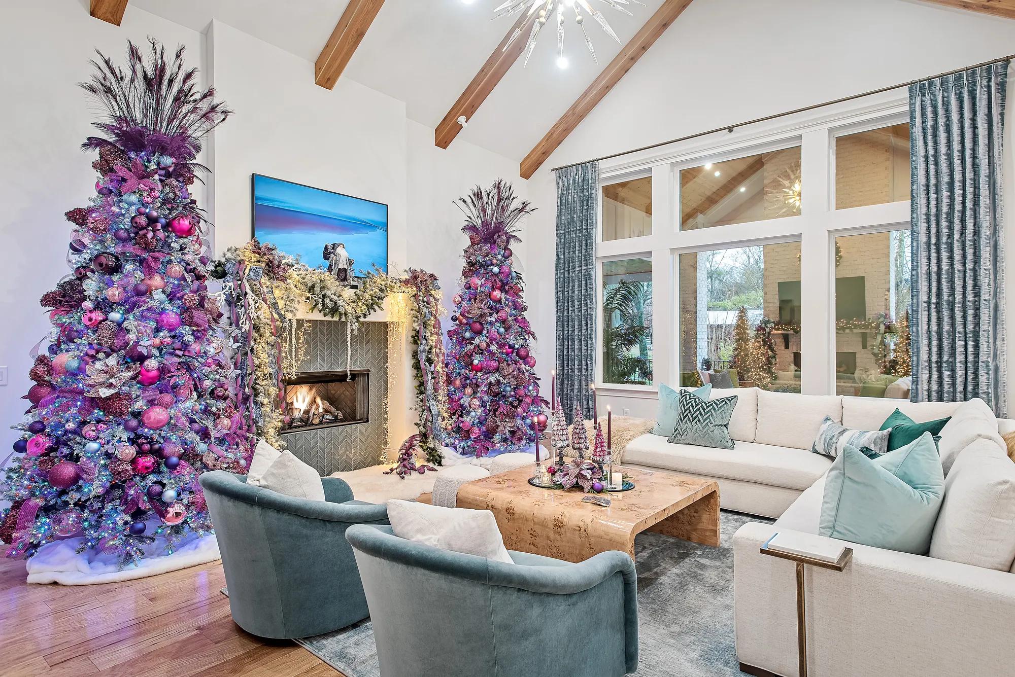 custom Drees home family room with purple trees flanking fireplace