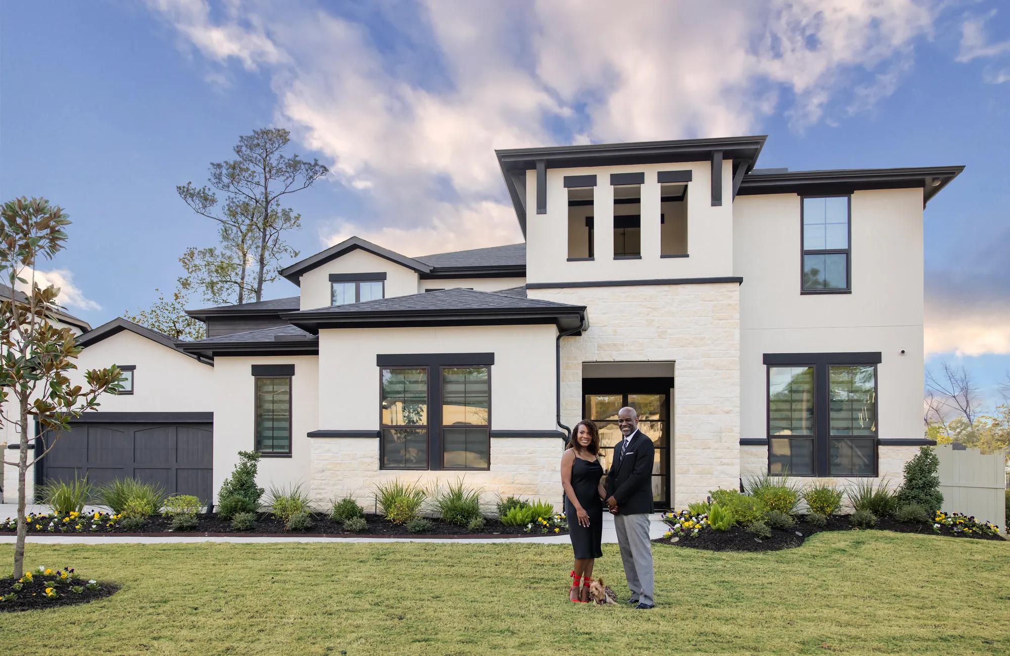 New homeowners enjoying their beautiful brick Drees Home