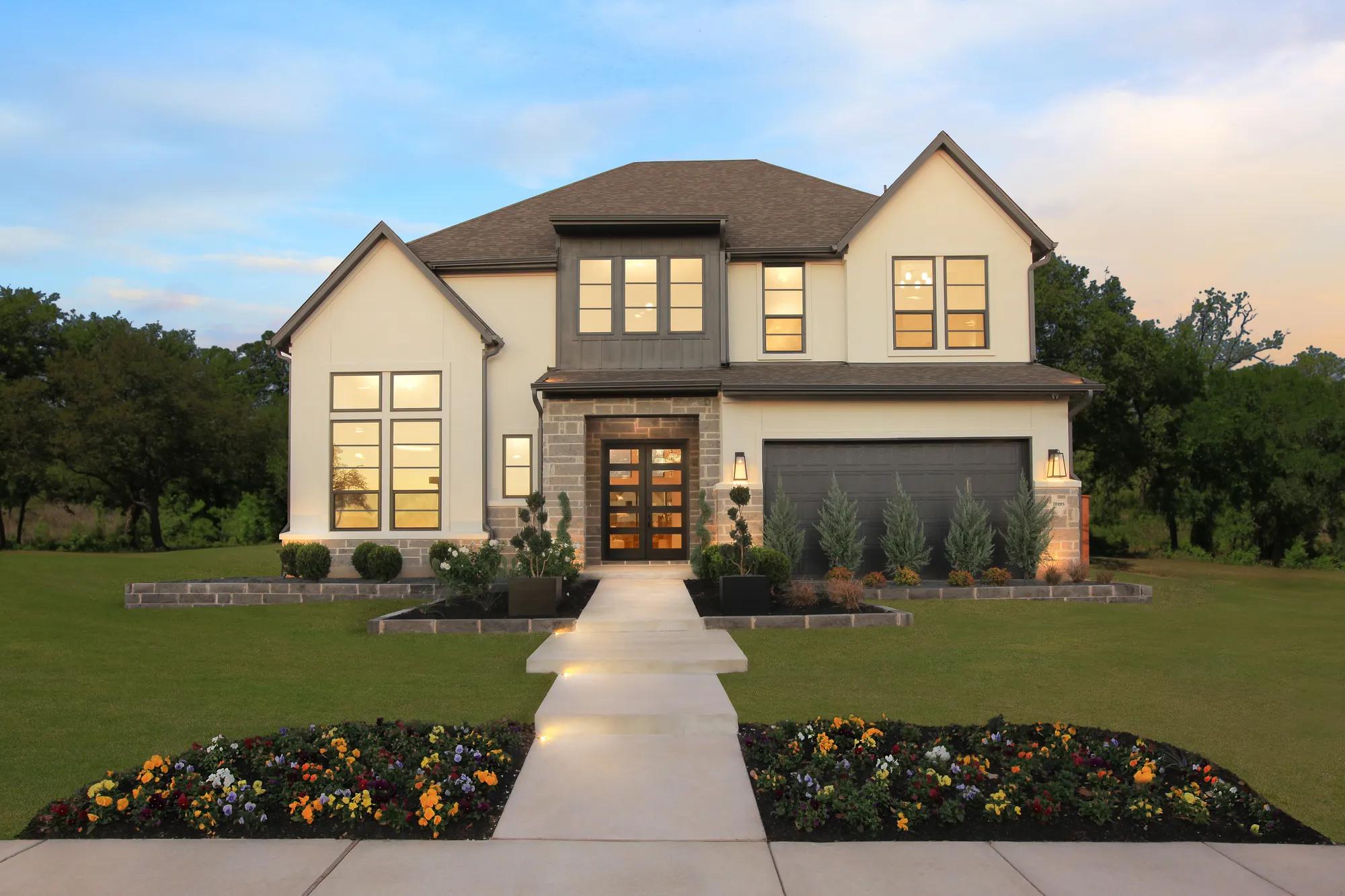 Texas new construction two-story home front exterior and landscaped yard