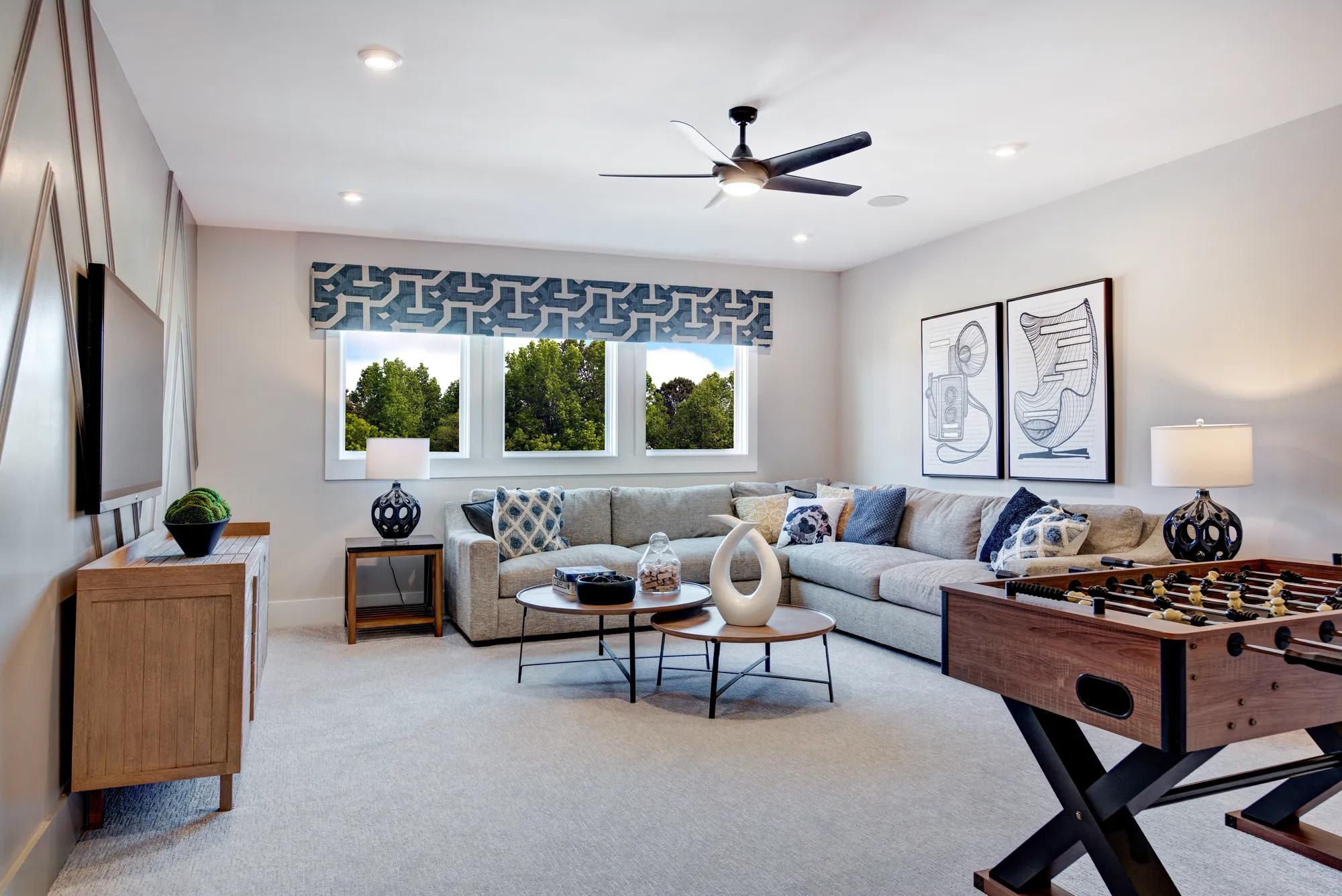 gameroom with sectional sofa and foosball table