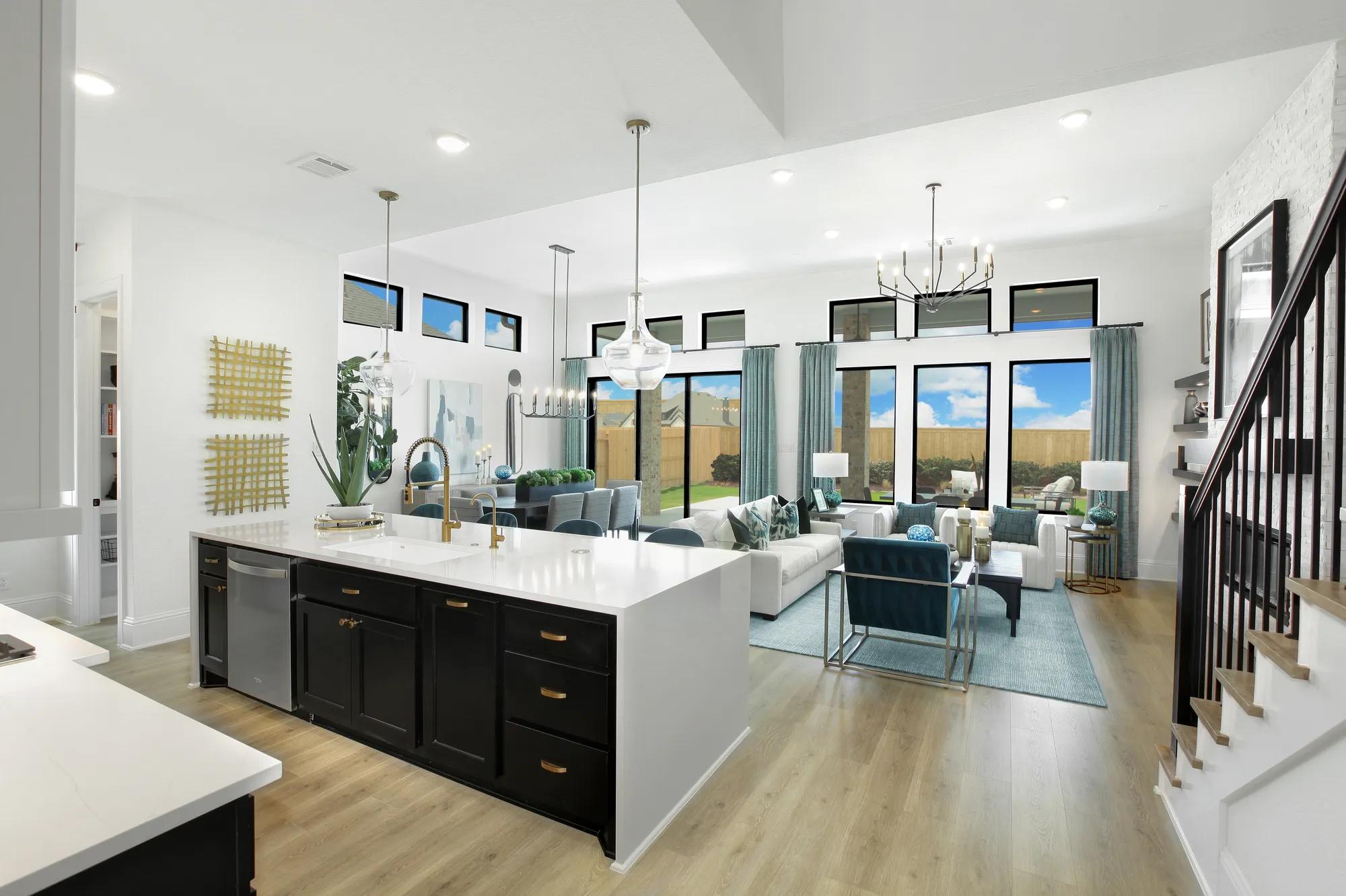 New home open floor plan kitchen, dining, family room with wall of windows