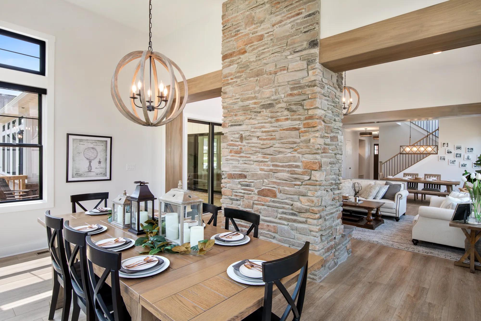 Beautiful dining room accompanied by luminous windows all around