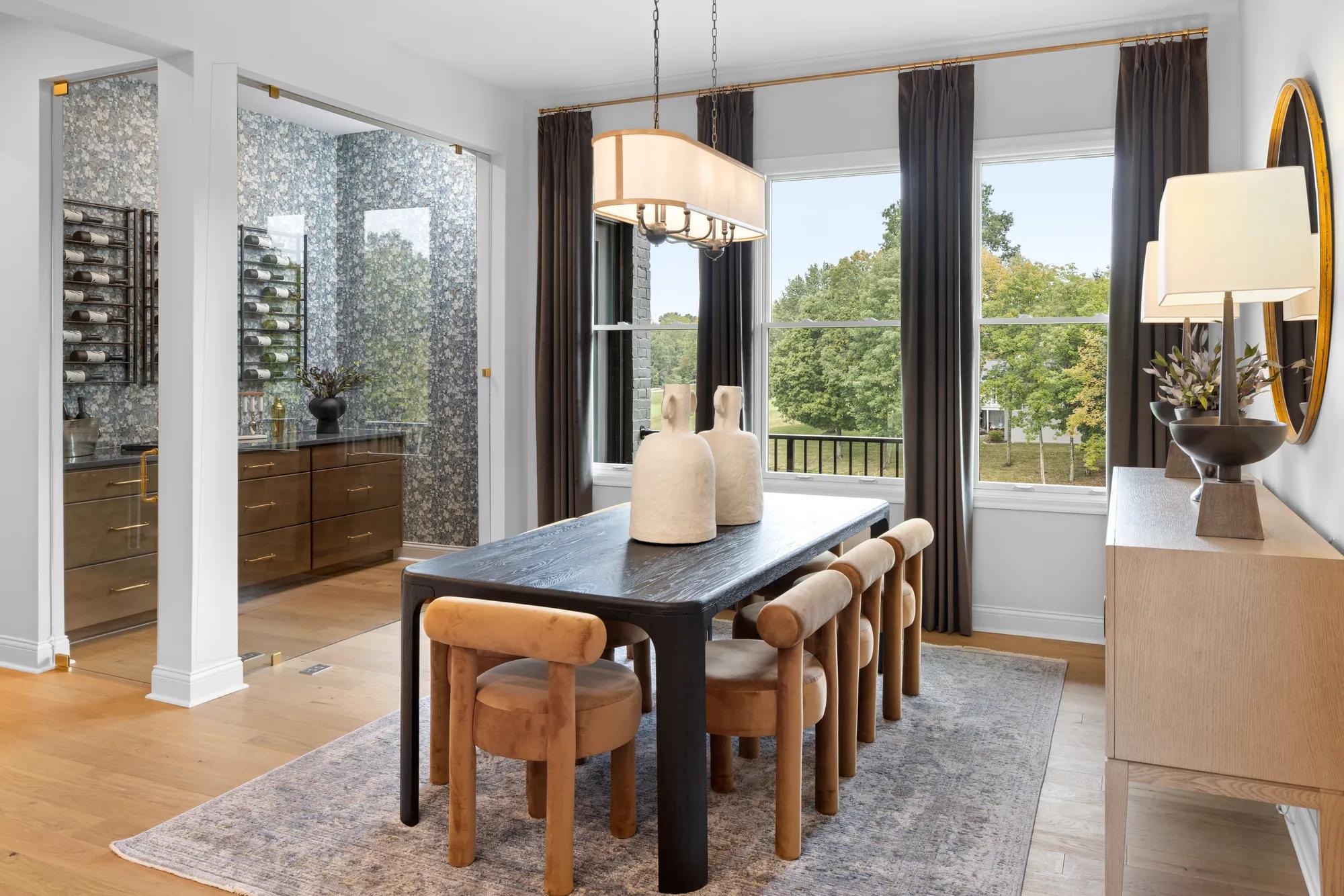 Custom home dining room with glass wine room