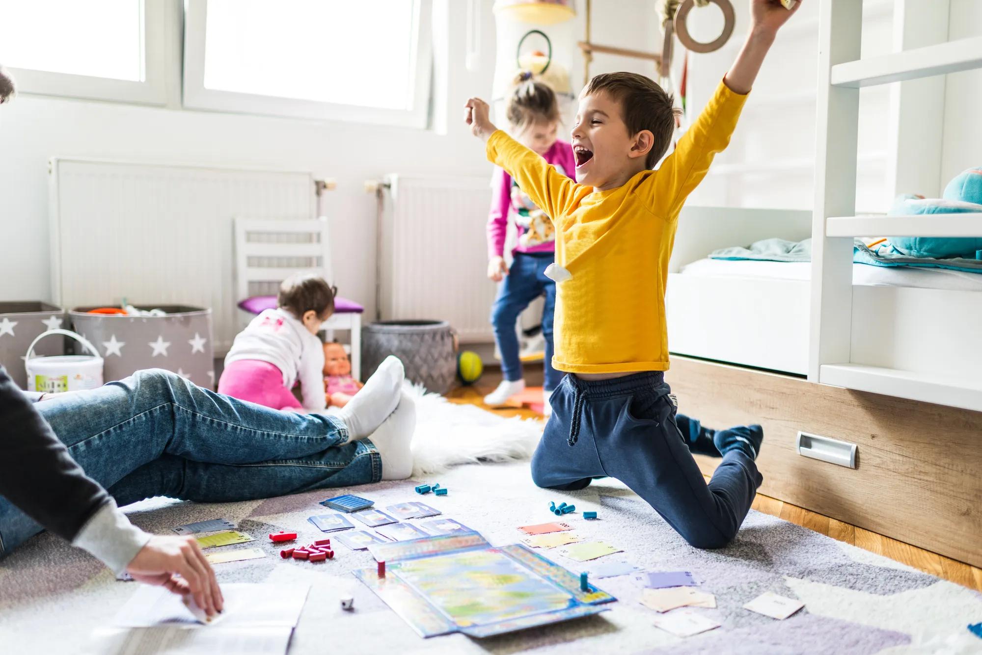 Family playing board games together in their new home