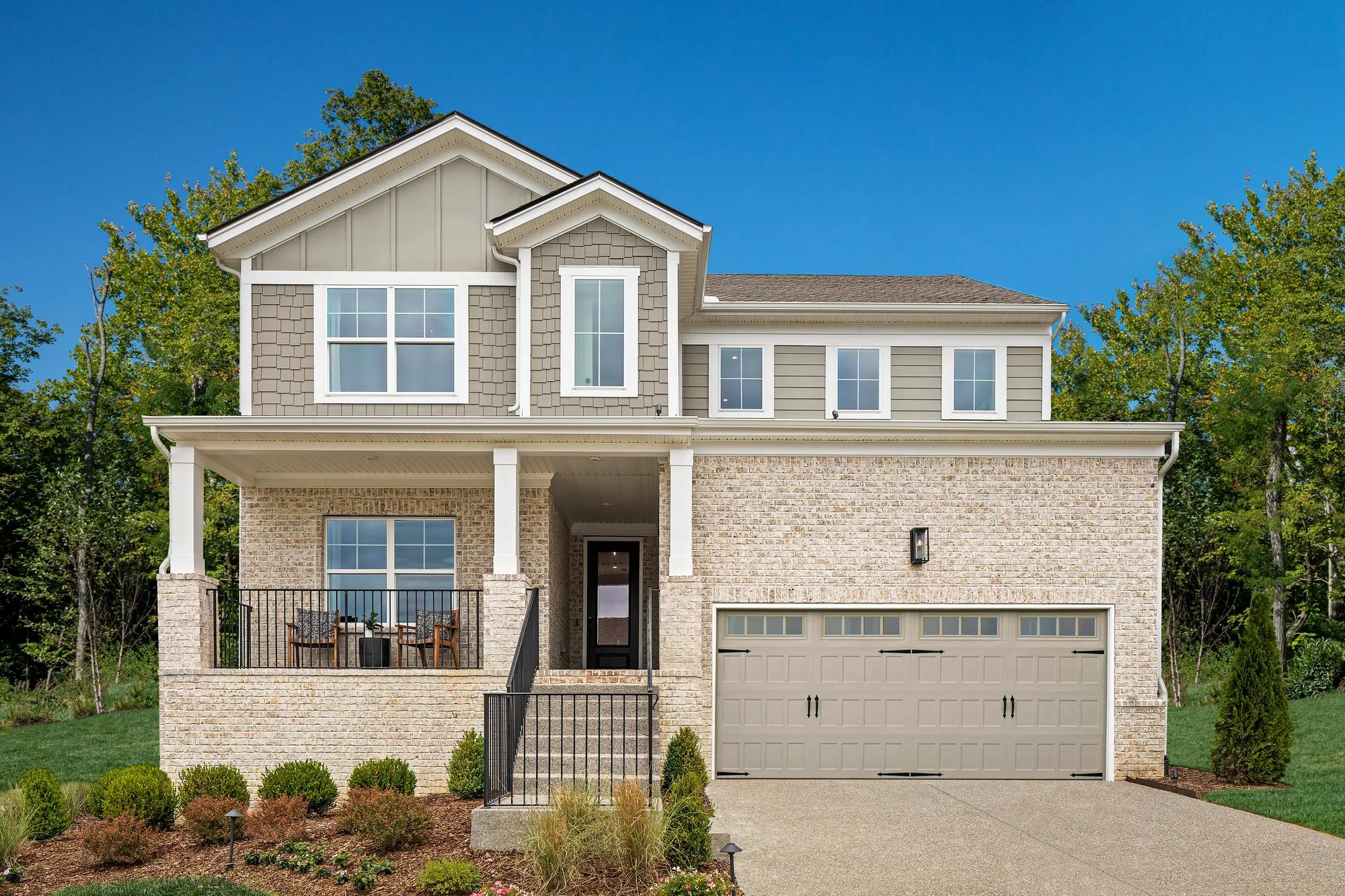 custom home with board and batten, shakes, siding and brick