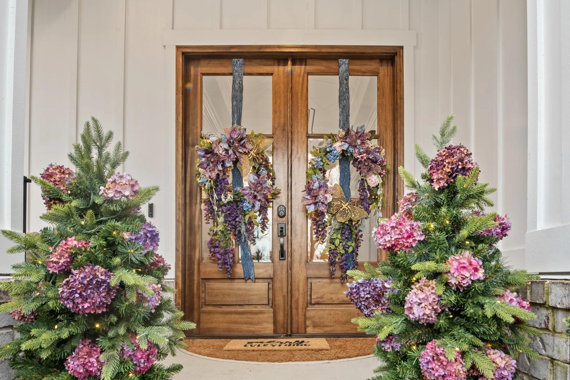 new Drees home with holiday wreaths on the double front doors