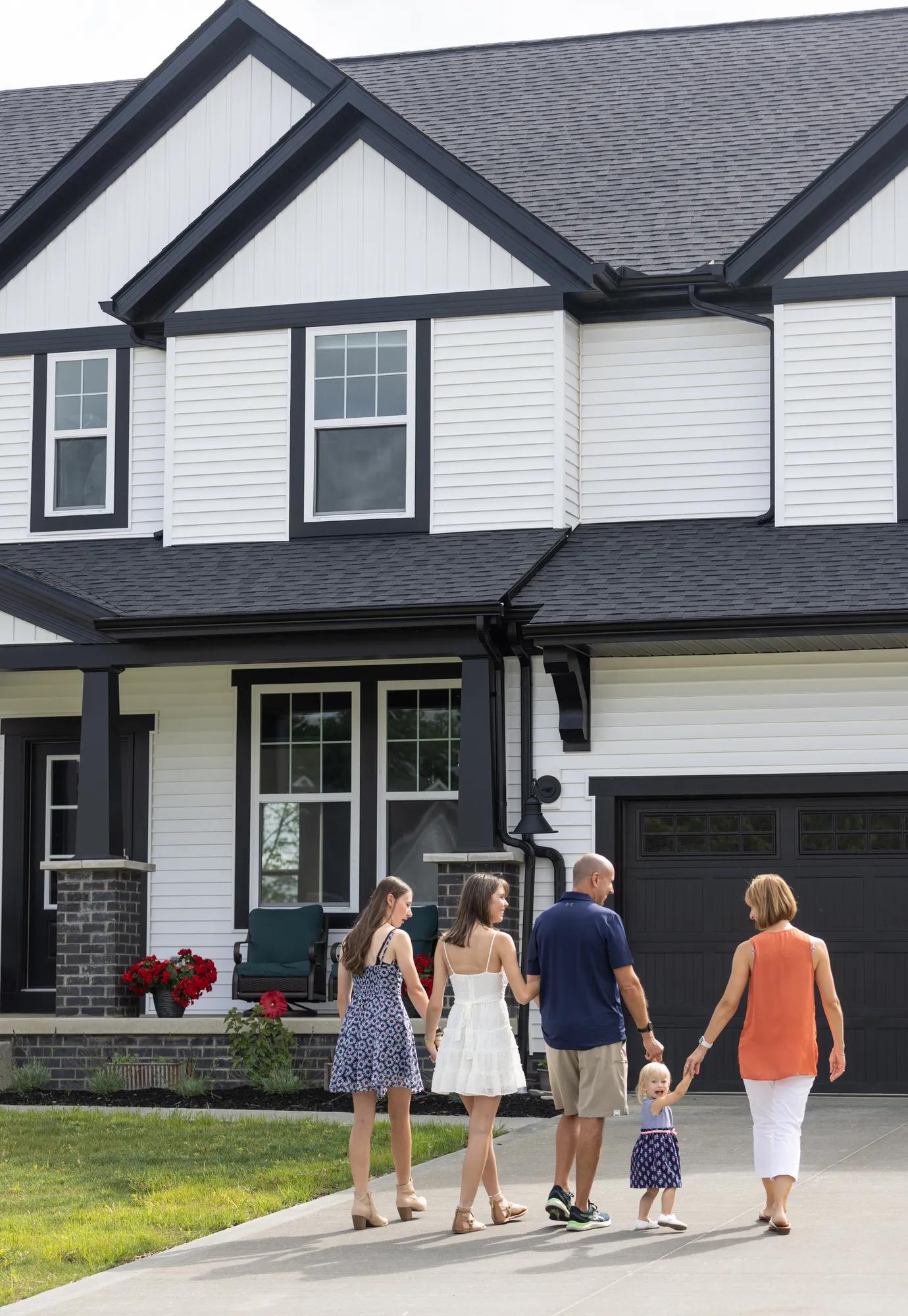 New homeowners enjoying the front yard of the Buchanan Drees Home