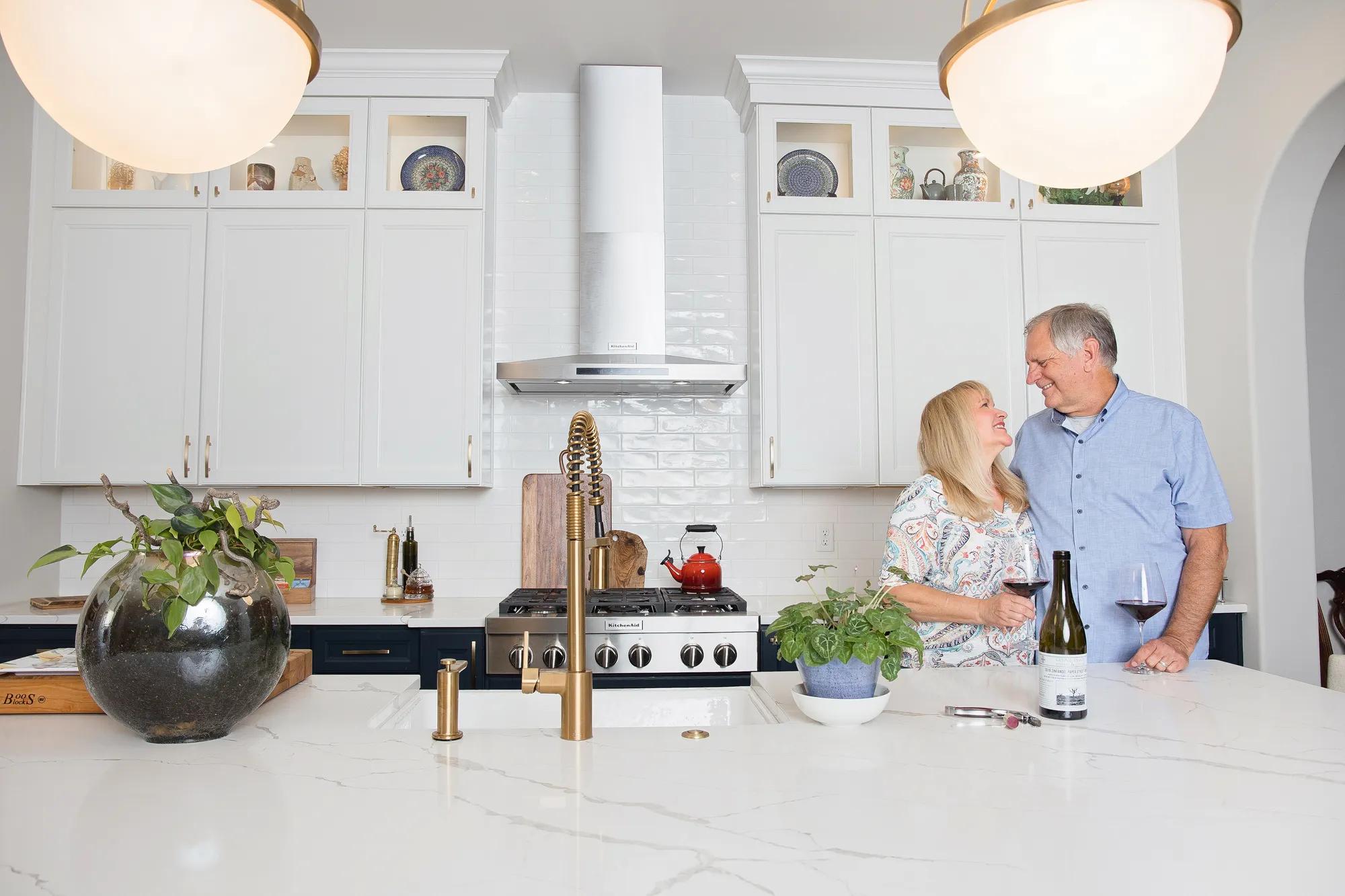 New homeowners in their Drees home kitchen