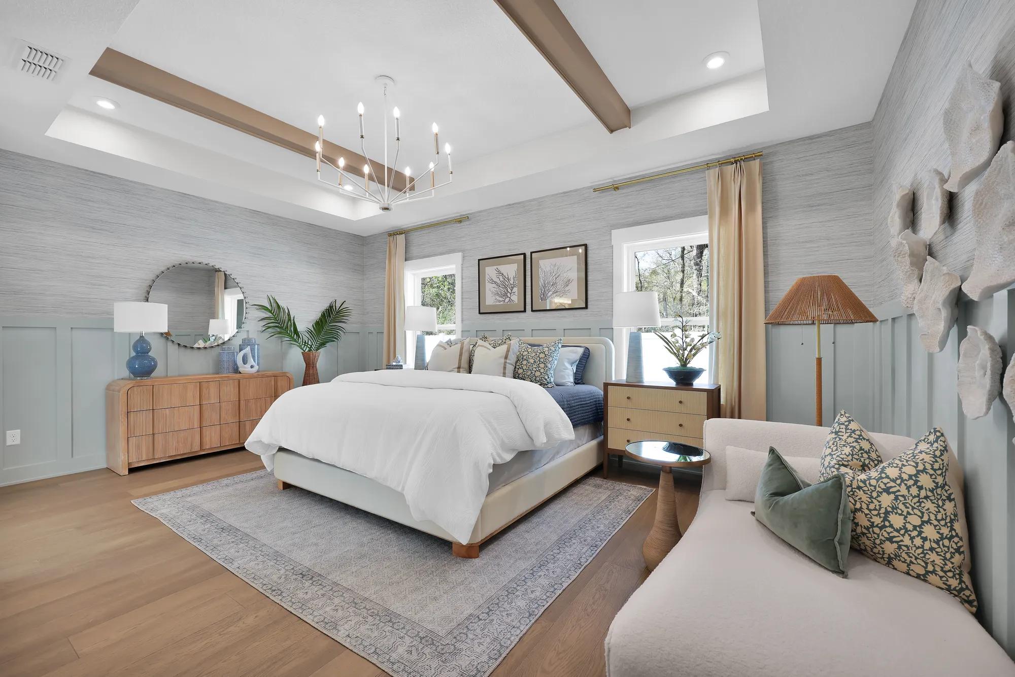 new home primary bedroom with beam ceiling