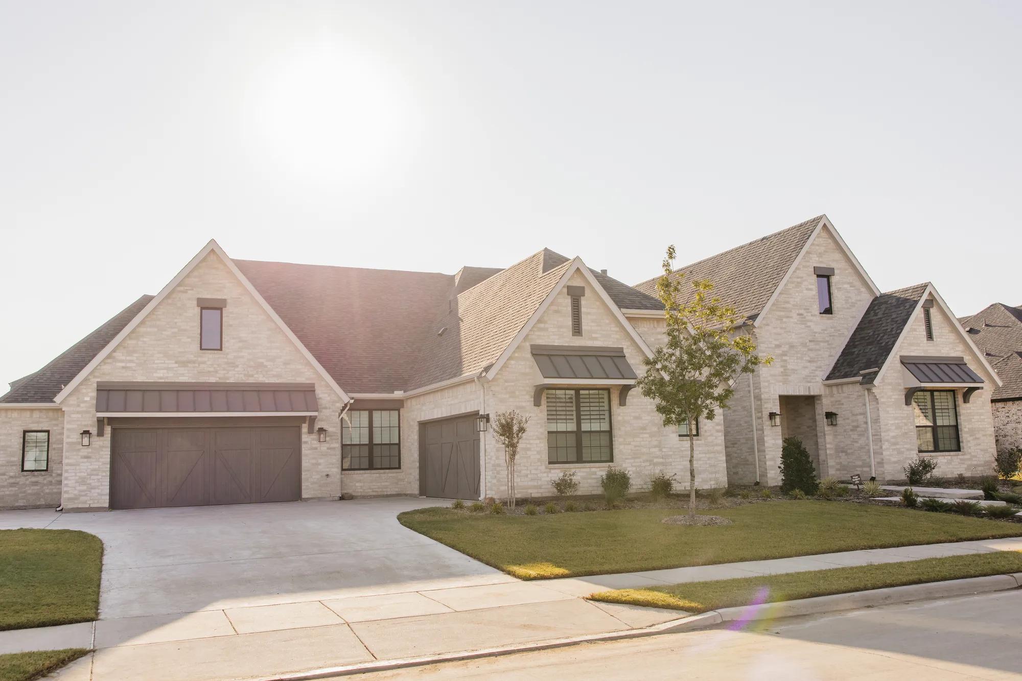 New homeowners enjoying a beautiful day with a stunning view of their Drees home