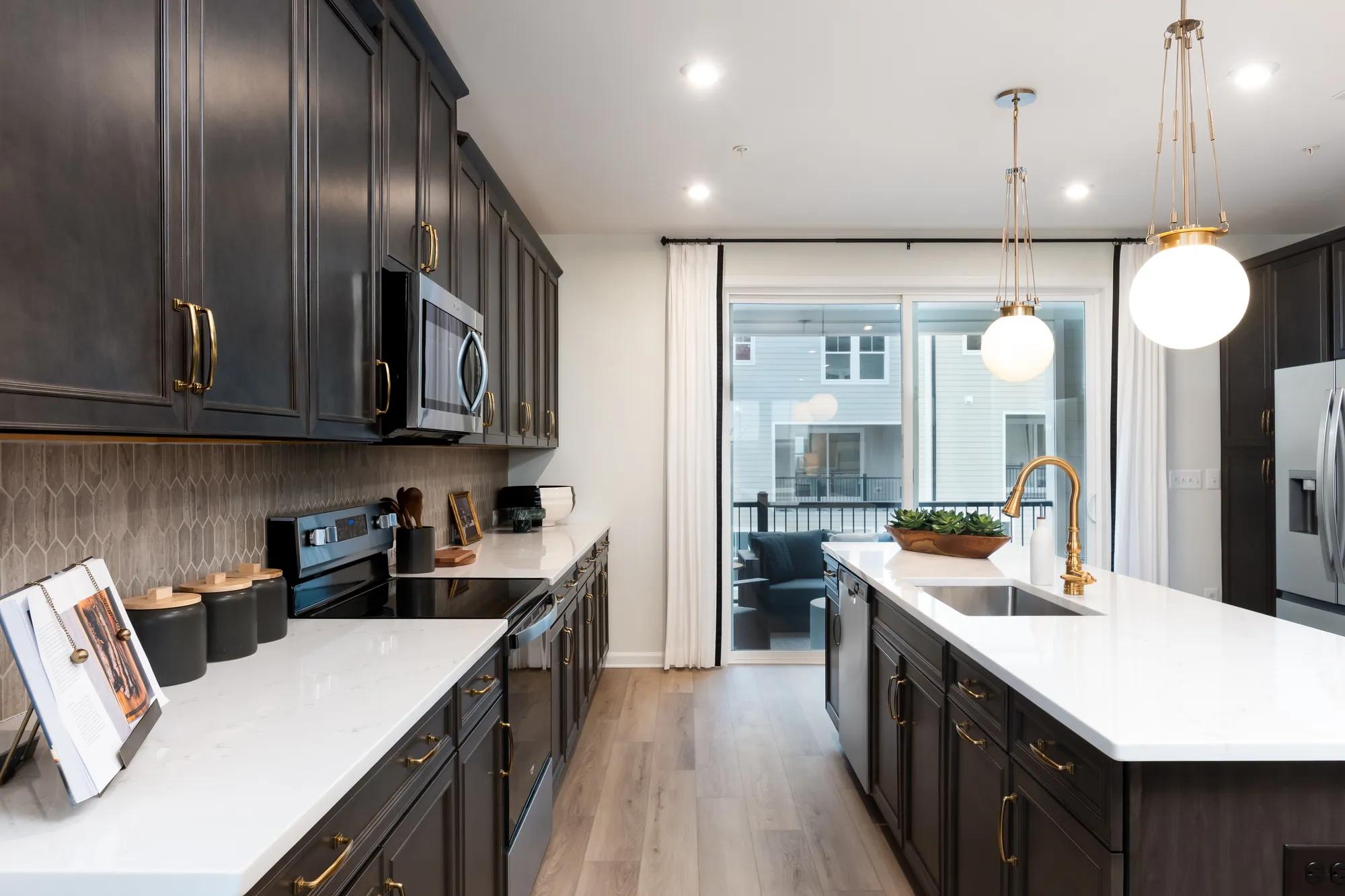 New townhome kitchen with dark wood cabinets and island