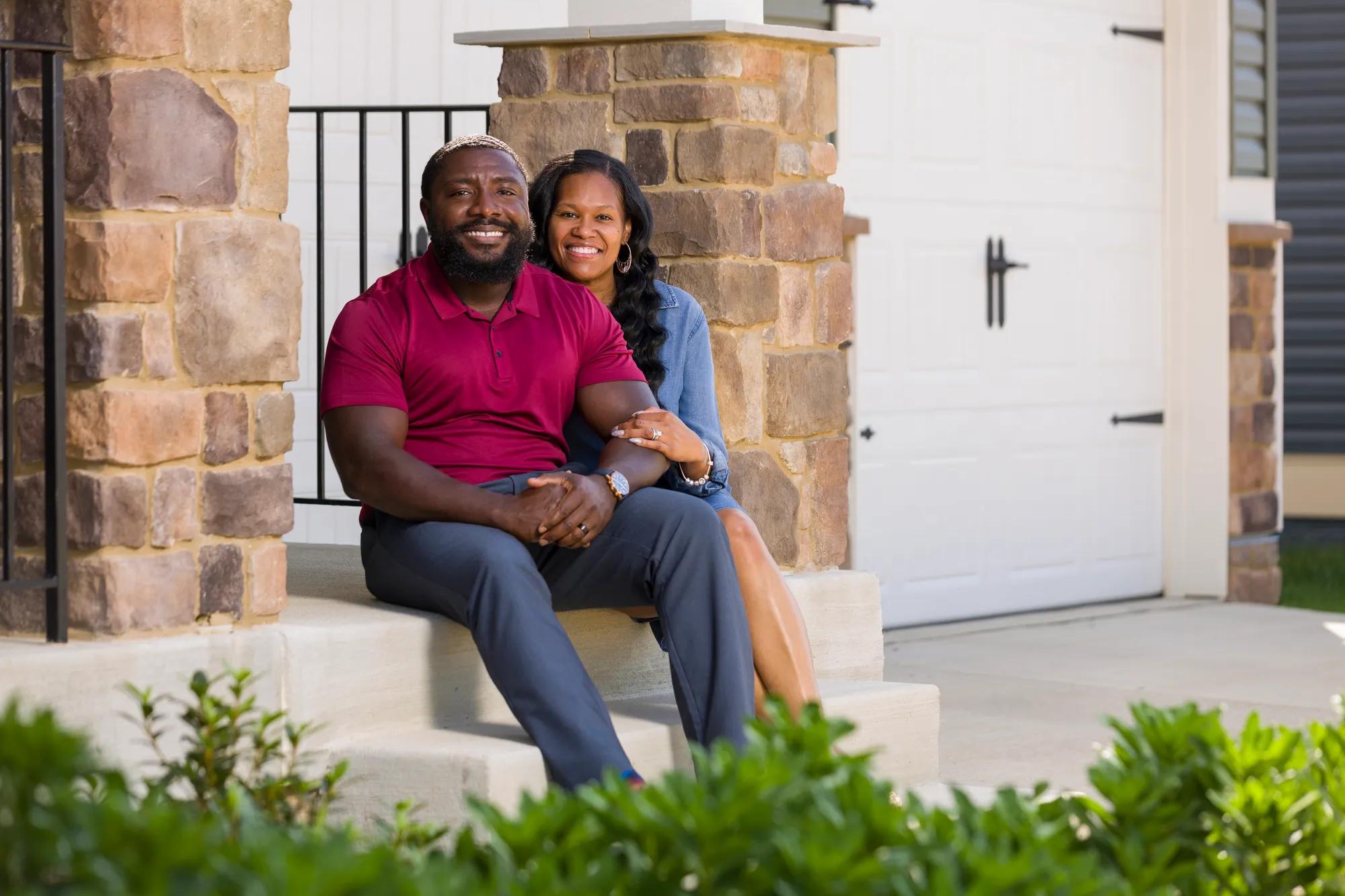 New homeowners outside of their Drees Home
