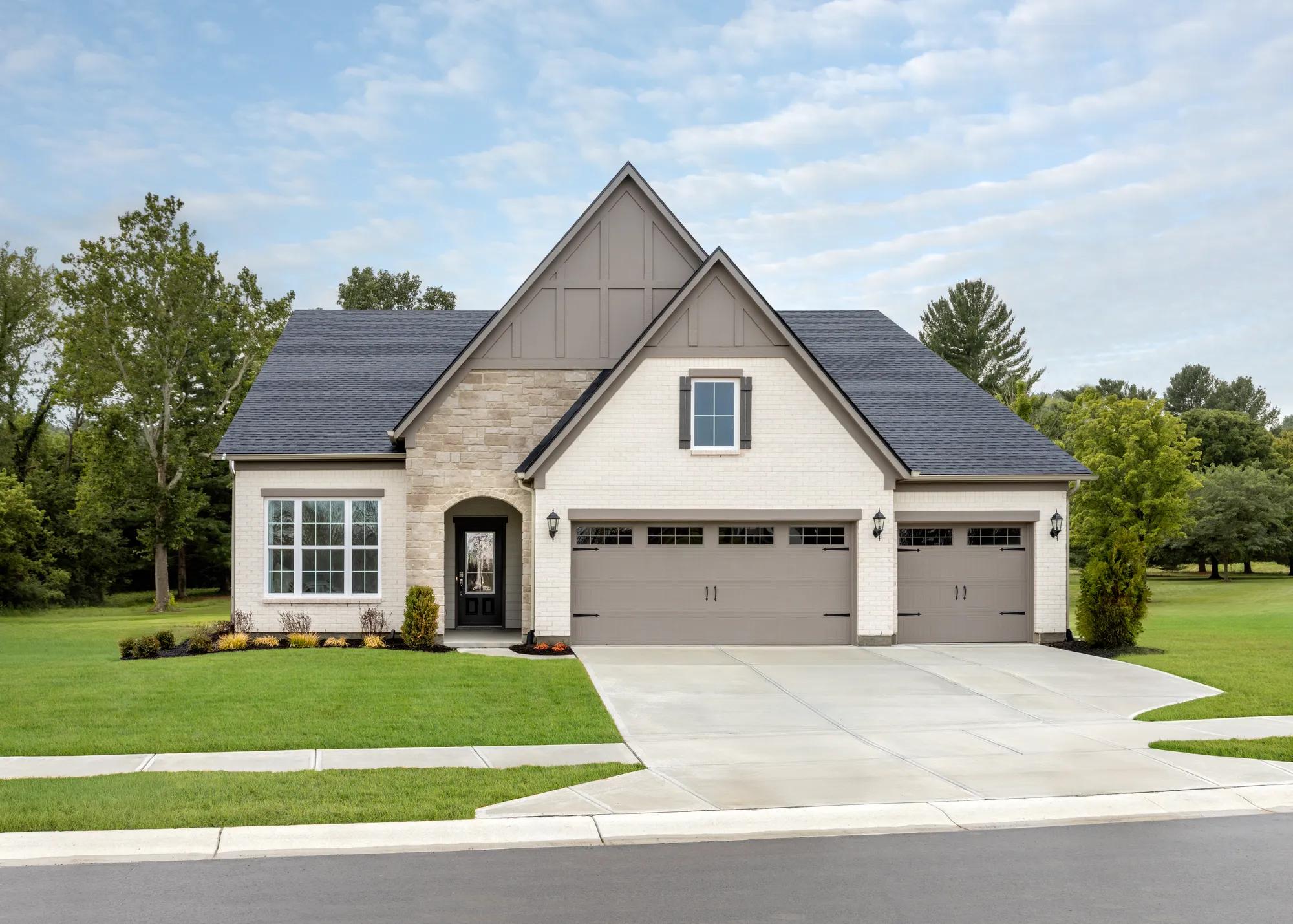custom home with stone and brick exterior