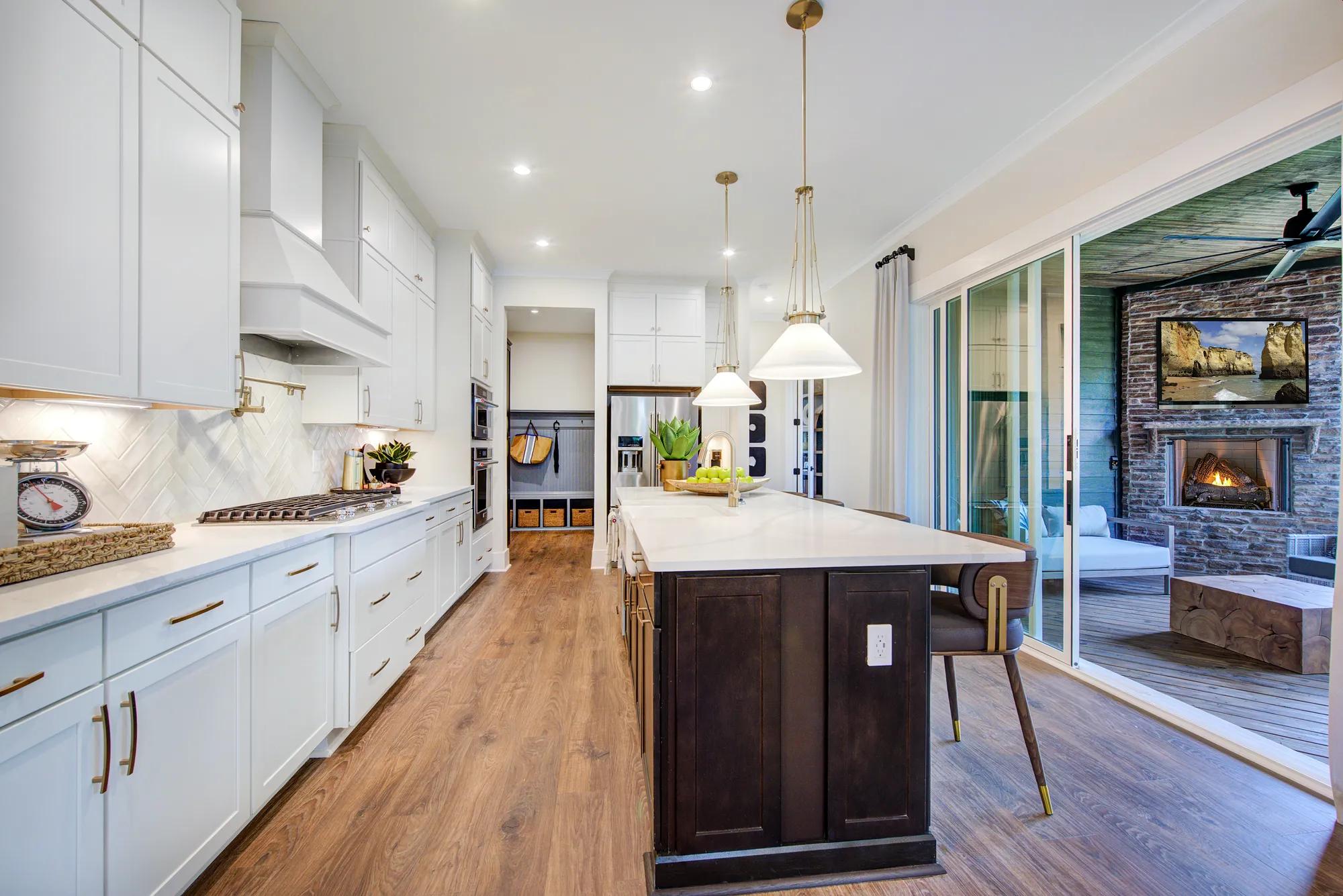 Custom home kitchen with sliding glass doors to outdoor living area
