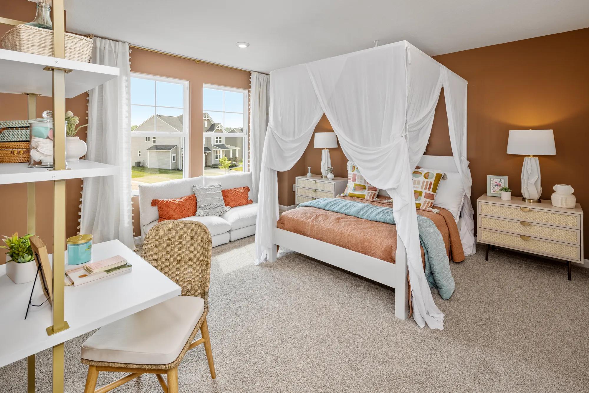secondary bedroom with canopy bed