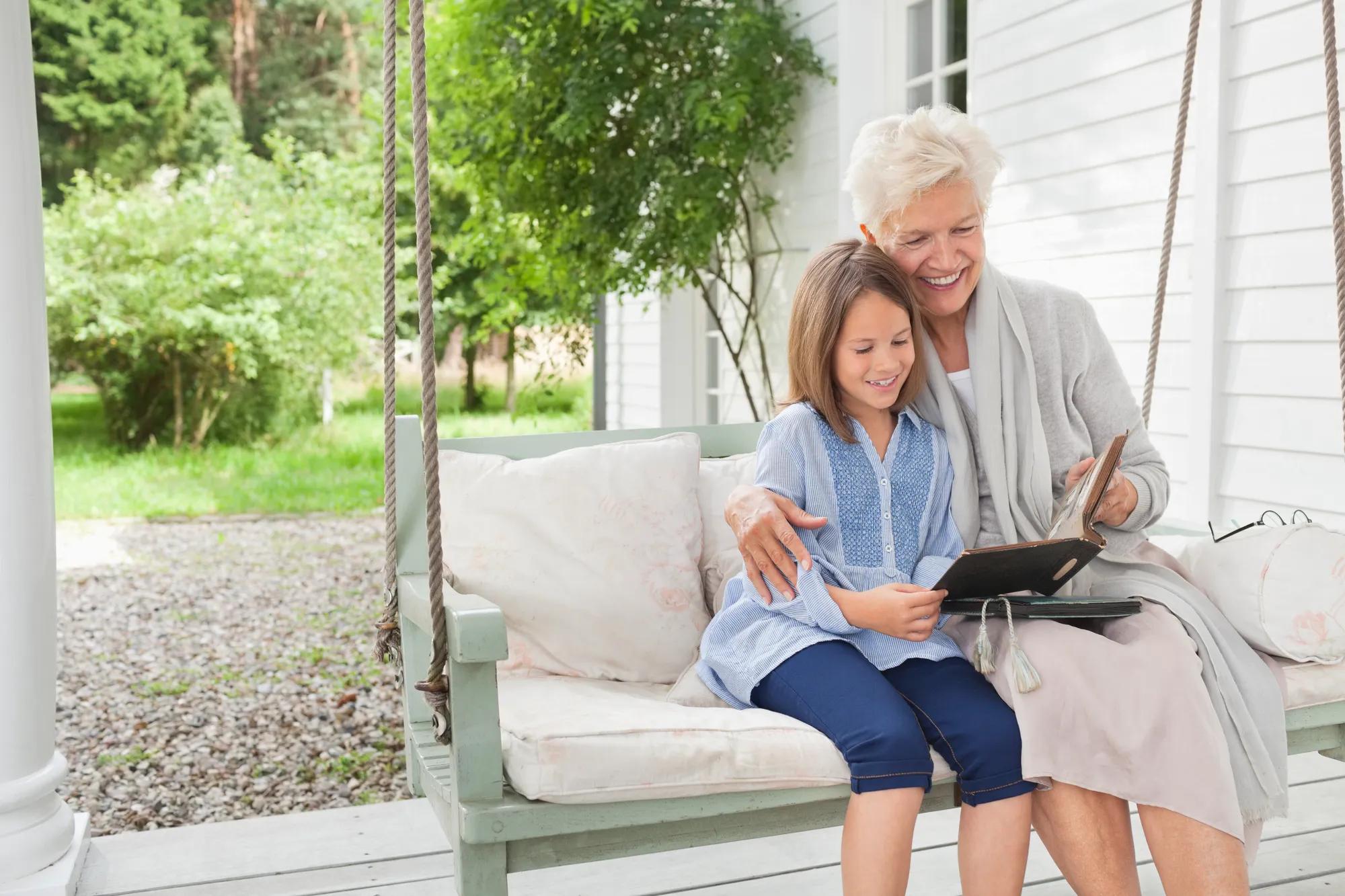 Grandmother and granddaughter enjoying new home front porch
