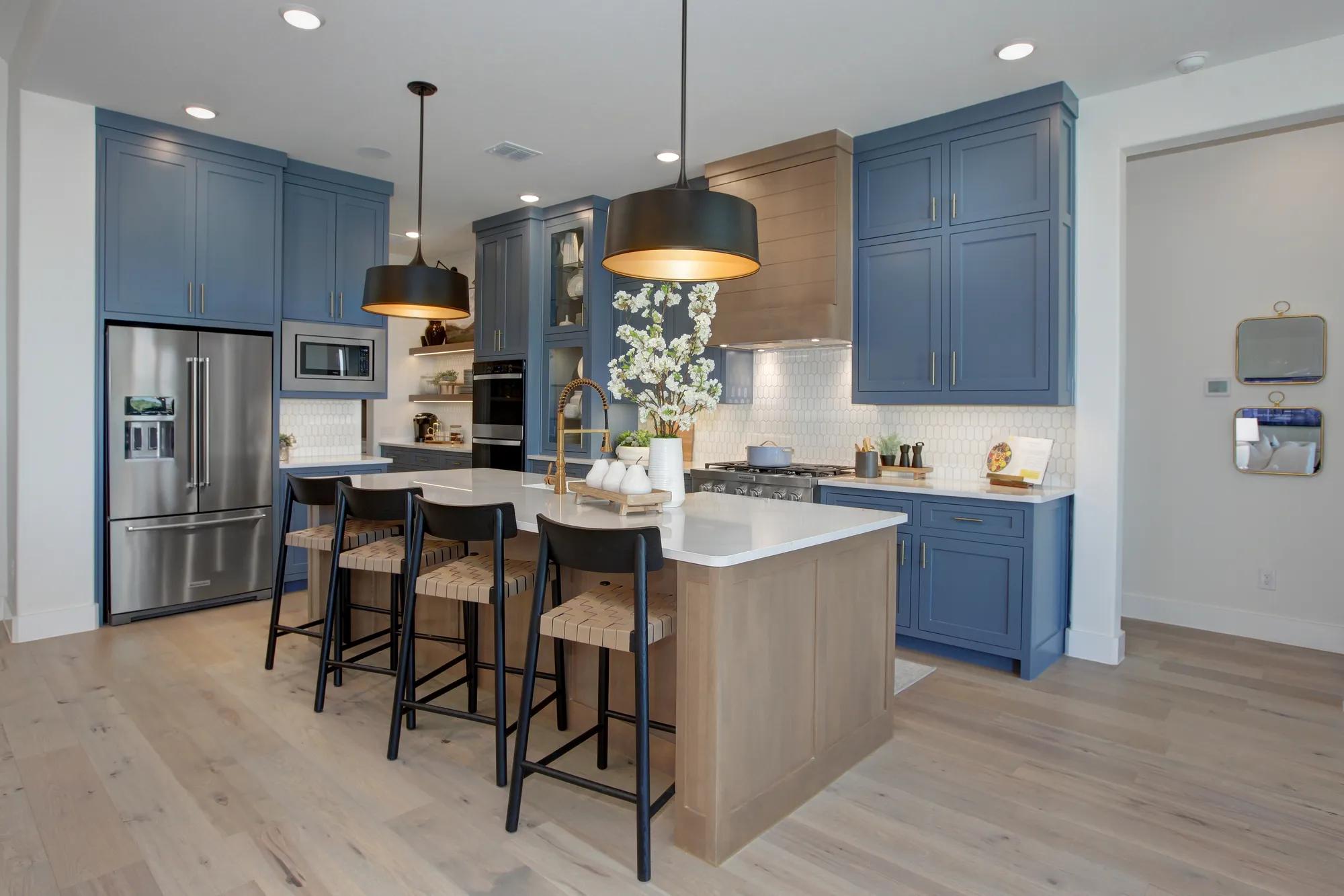 custom home kitchen with blue cabinets