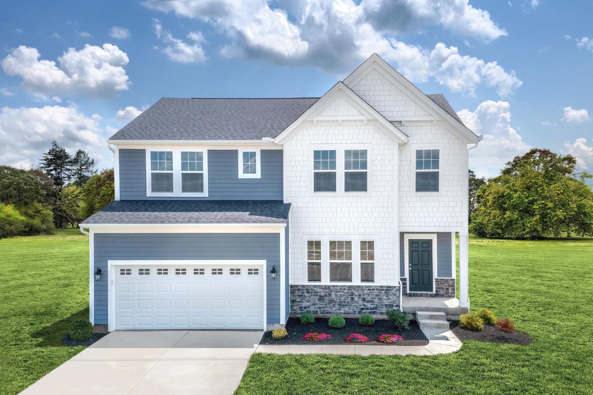 New construction home exterior with light blue siding