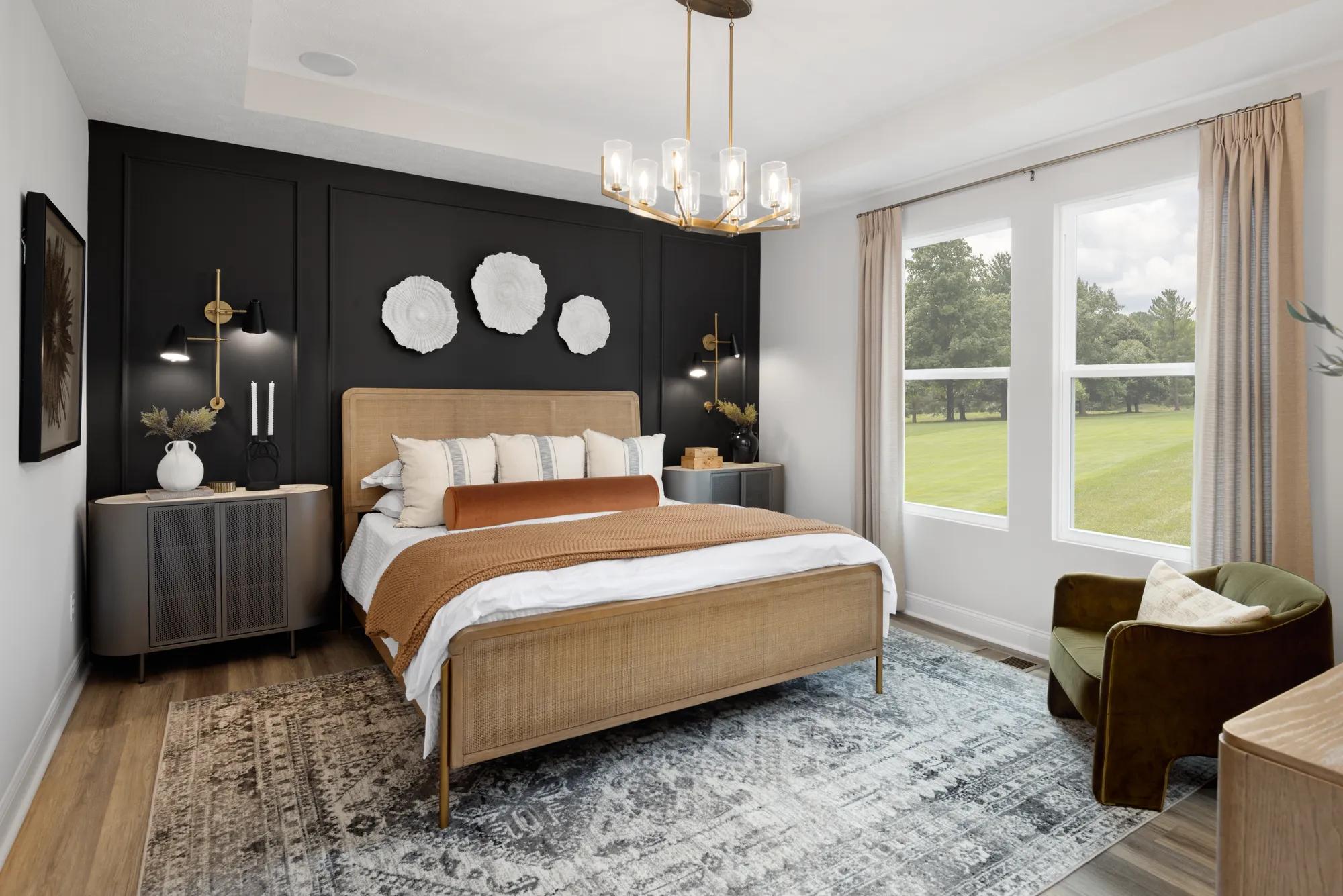 custom home primary bedroom with accent wall