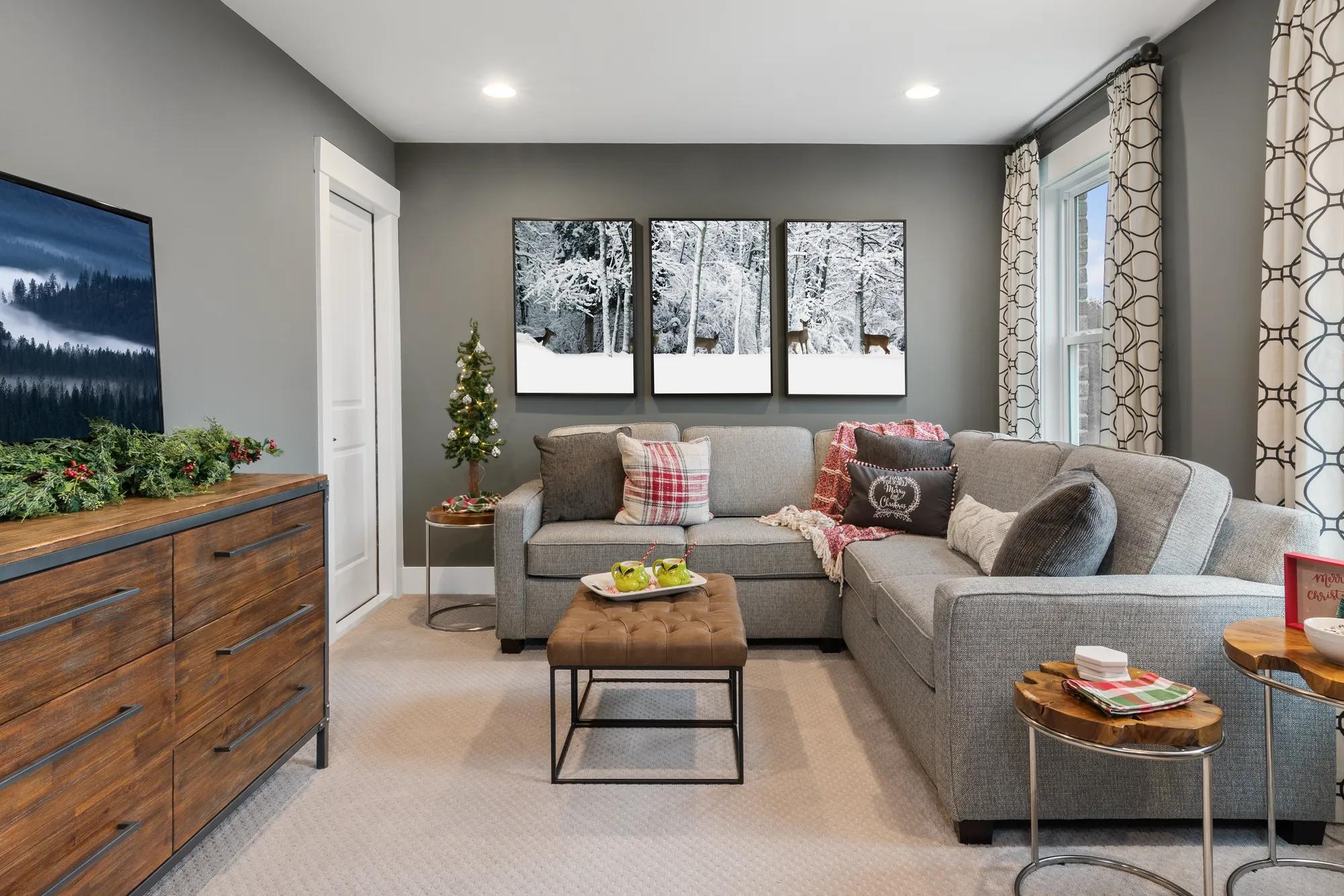 A gorgeous family room with holiday decorations in a custom home