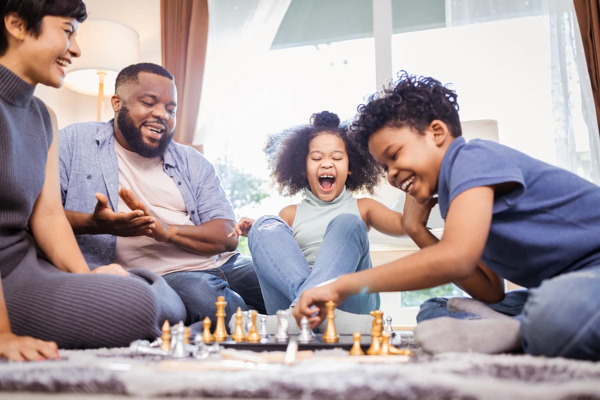 Family playing games together in their new home