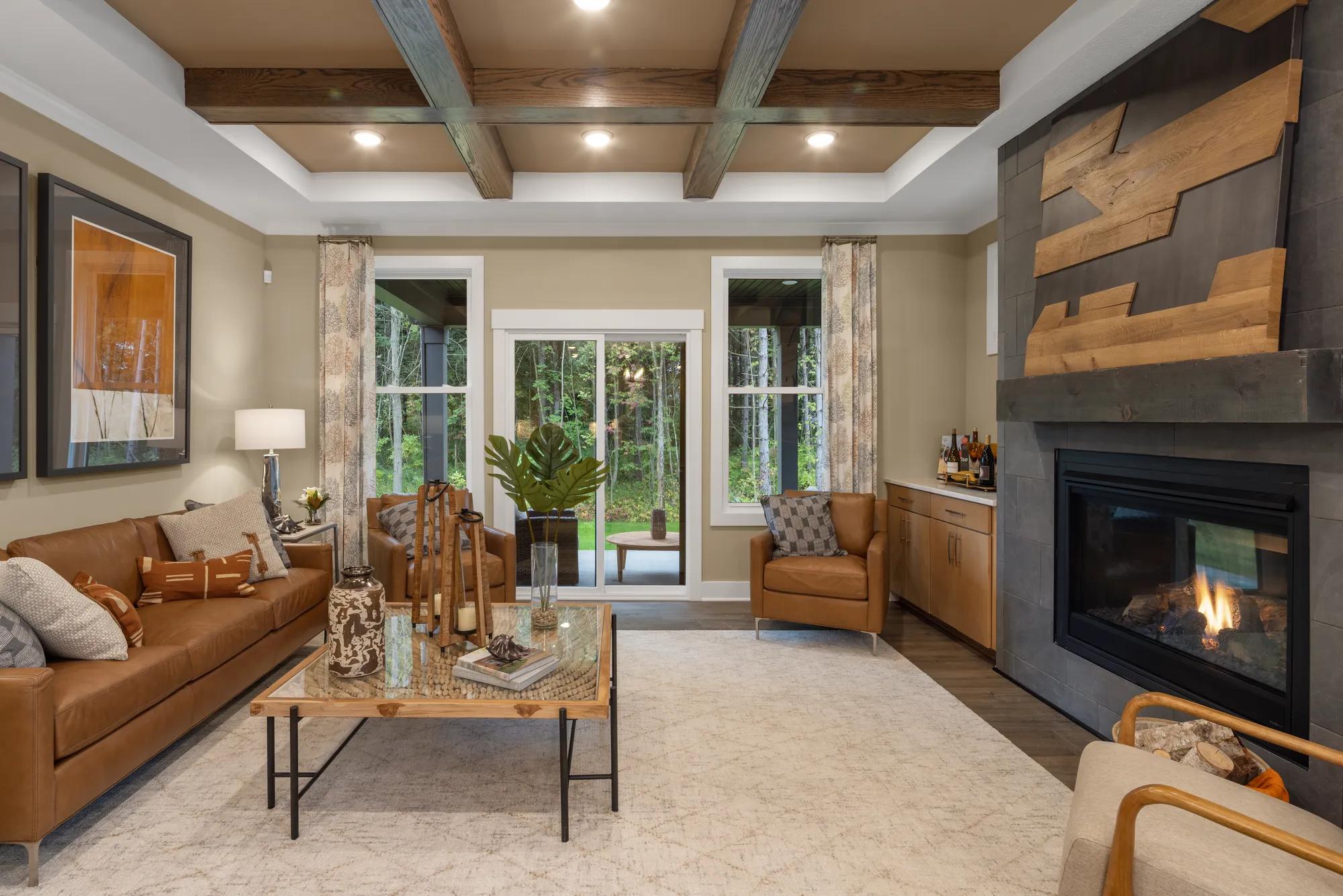 custom family room with beam ceiling