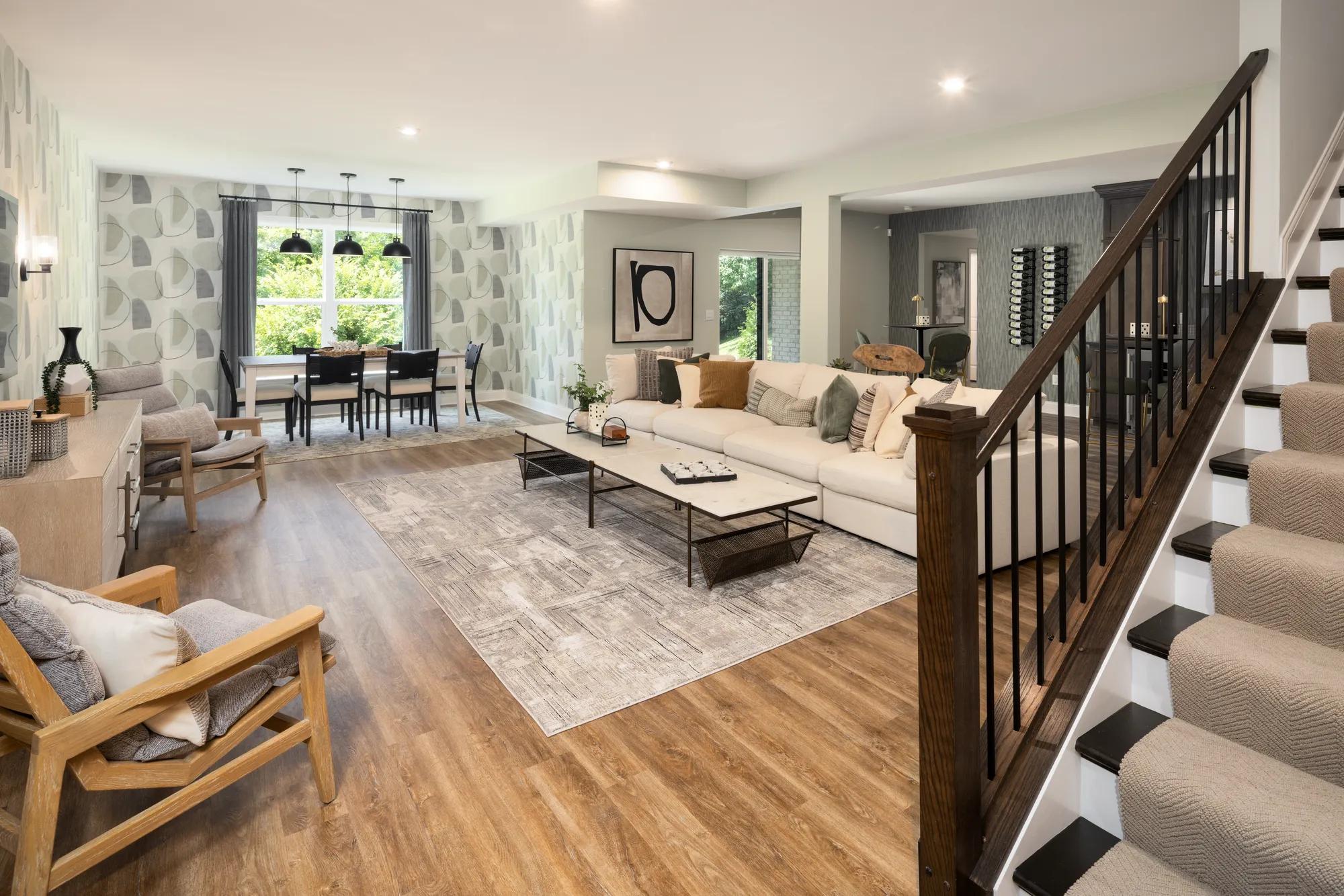 Finished basement with hardwood floor, living room area, and dining area