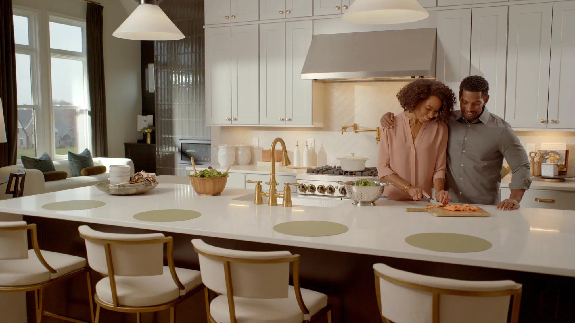 Couple hugging in custom home kitchen