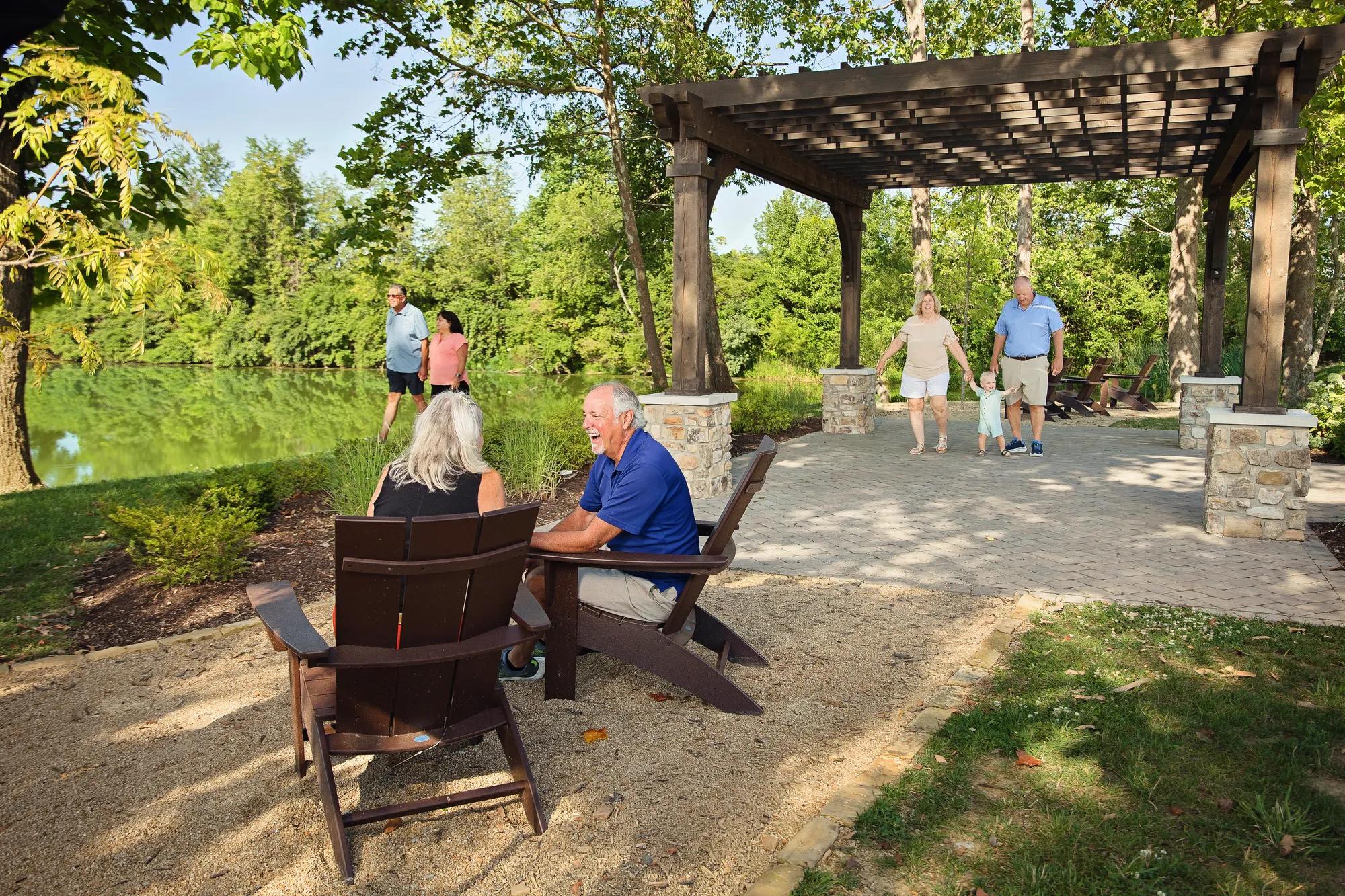 Group of people enjoying the walking path and pavilion at Trailhead in Harrison, OH