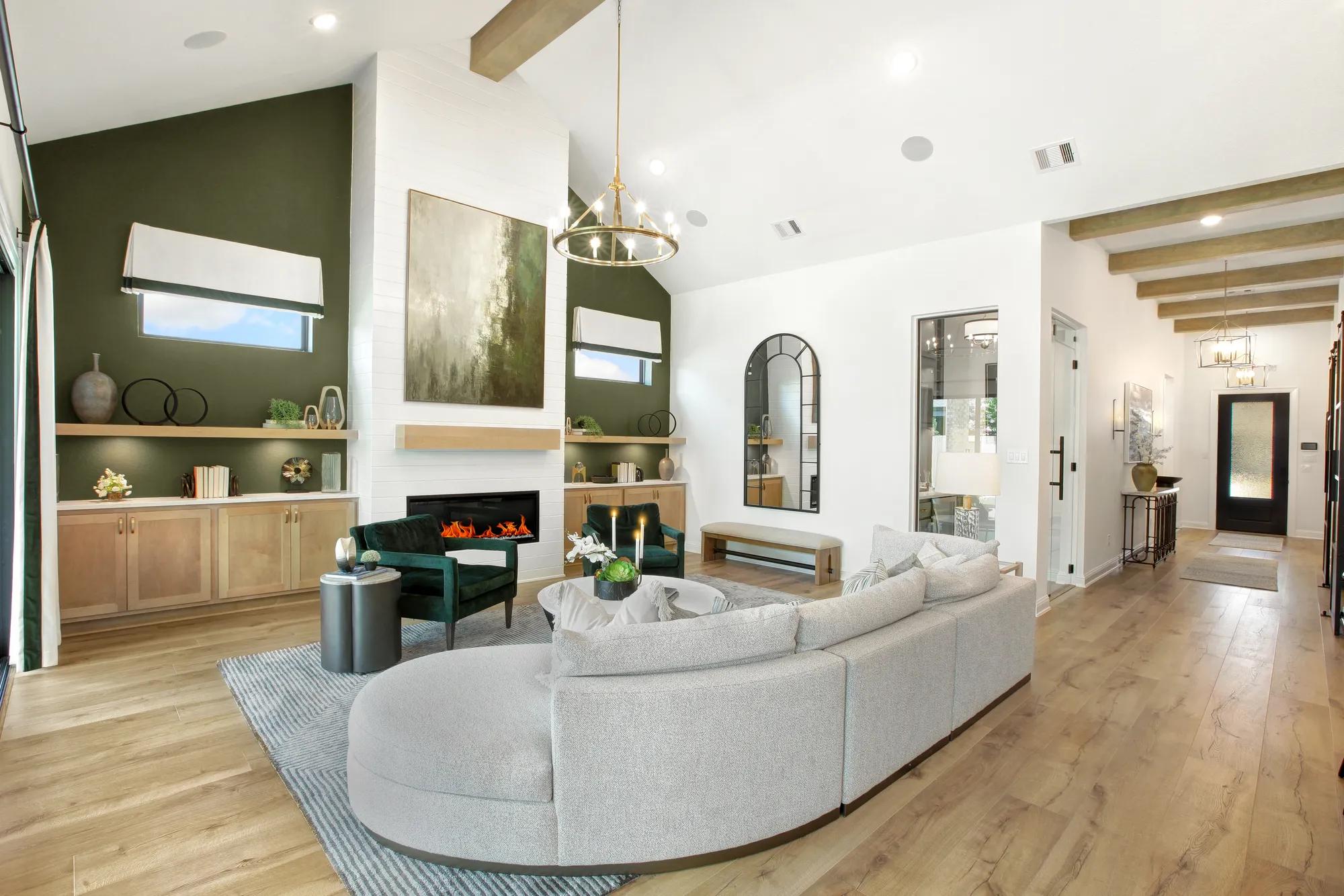 Custom home family room with vaulted wood beam ceiling