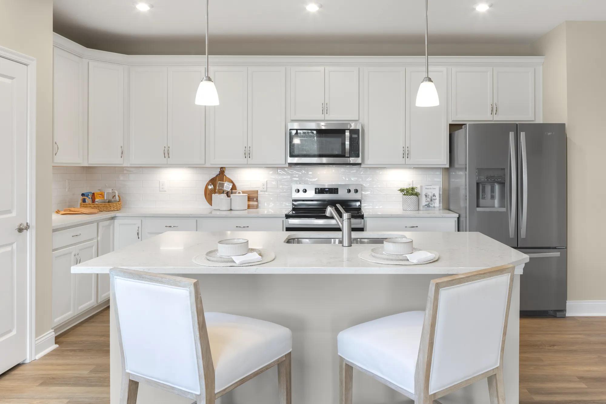 new Drees kitchen with island and white cabinets