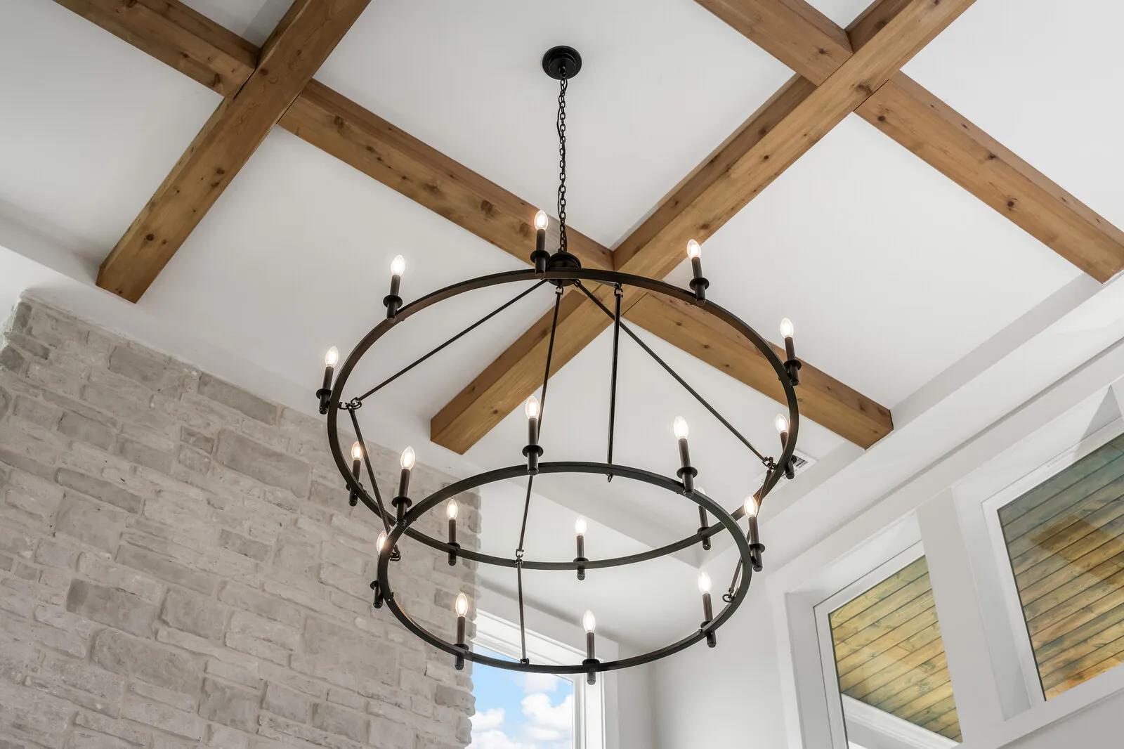 New home coffered wood beam ceiling with modern rustic black chandelier 