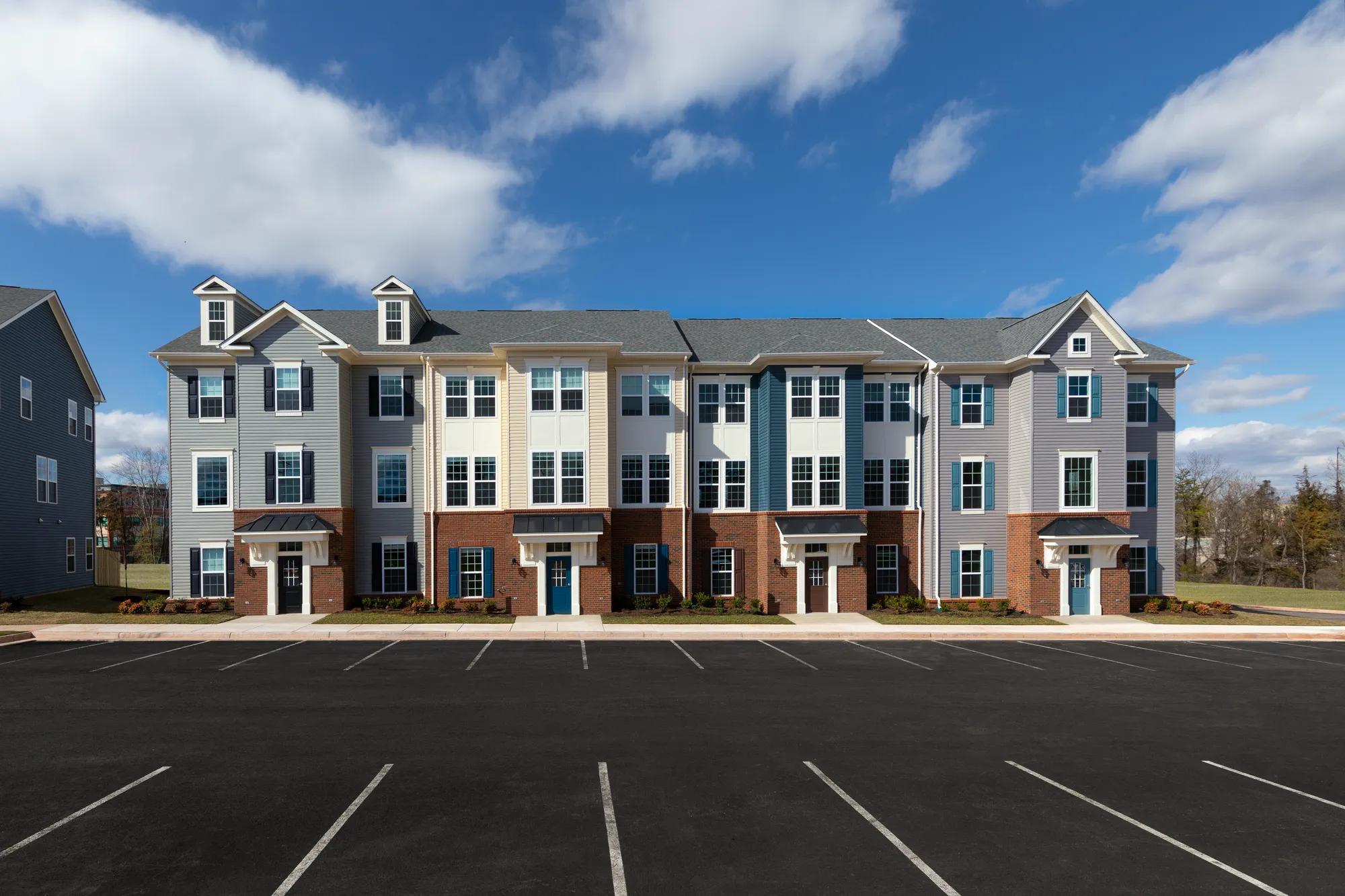 townhome building with four  doors