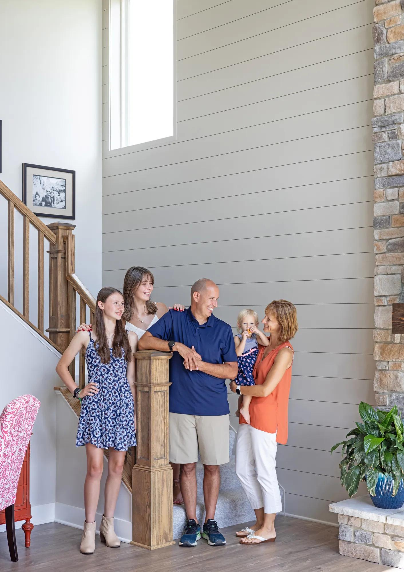 New homeowners gathering by the beautiful Buchanan stairs