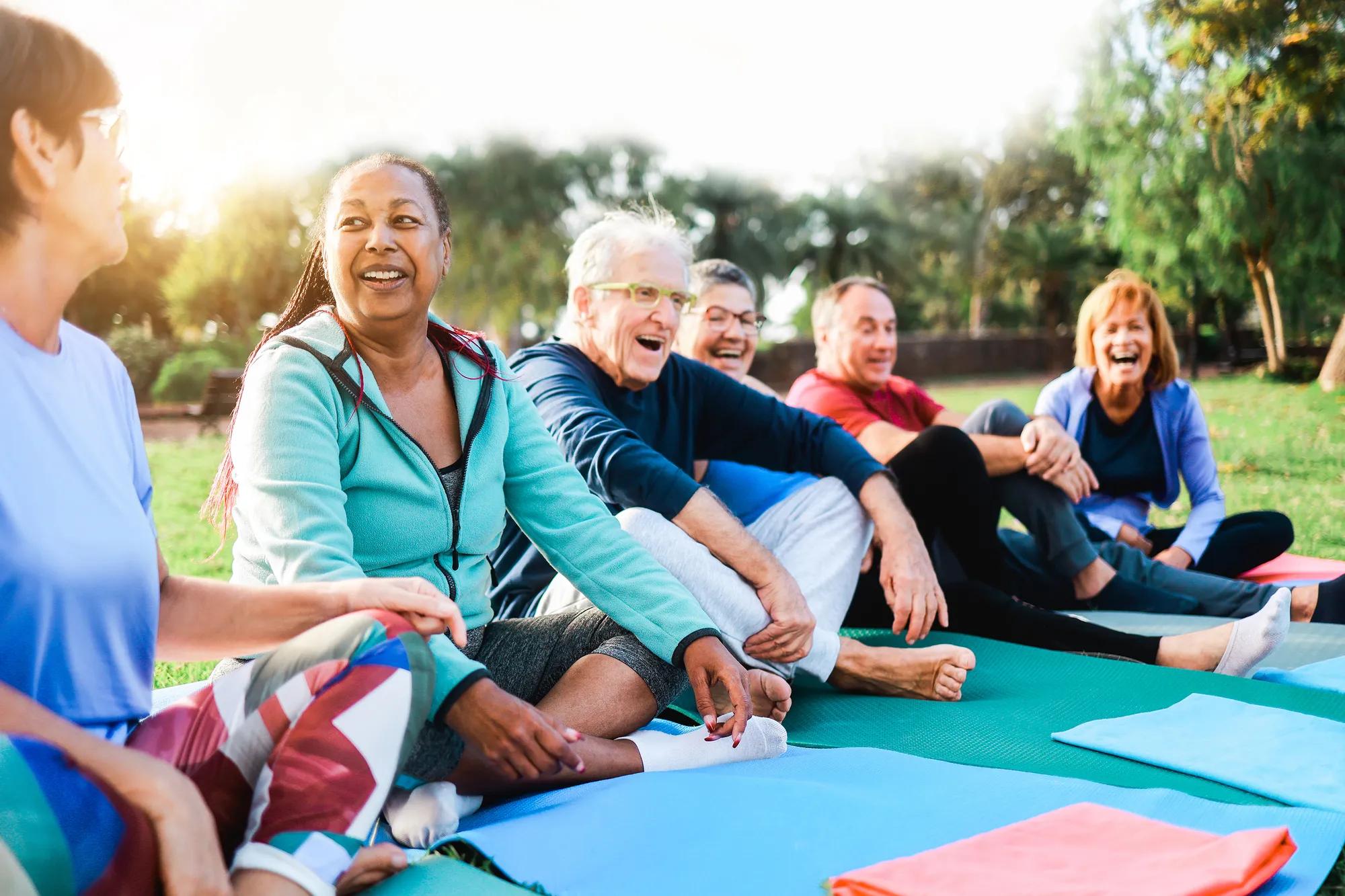 Friends exercising in outdoor green space