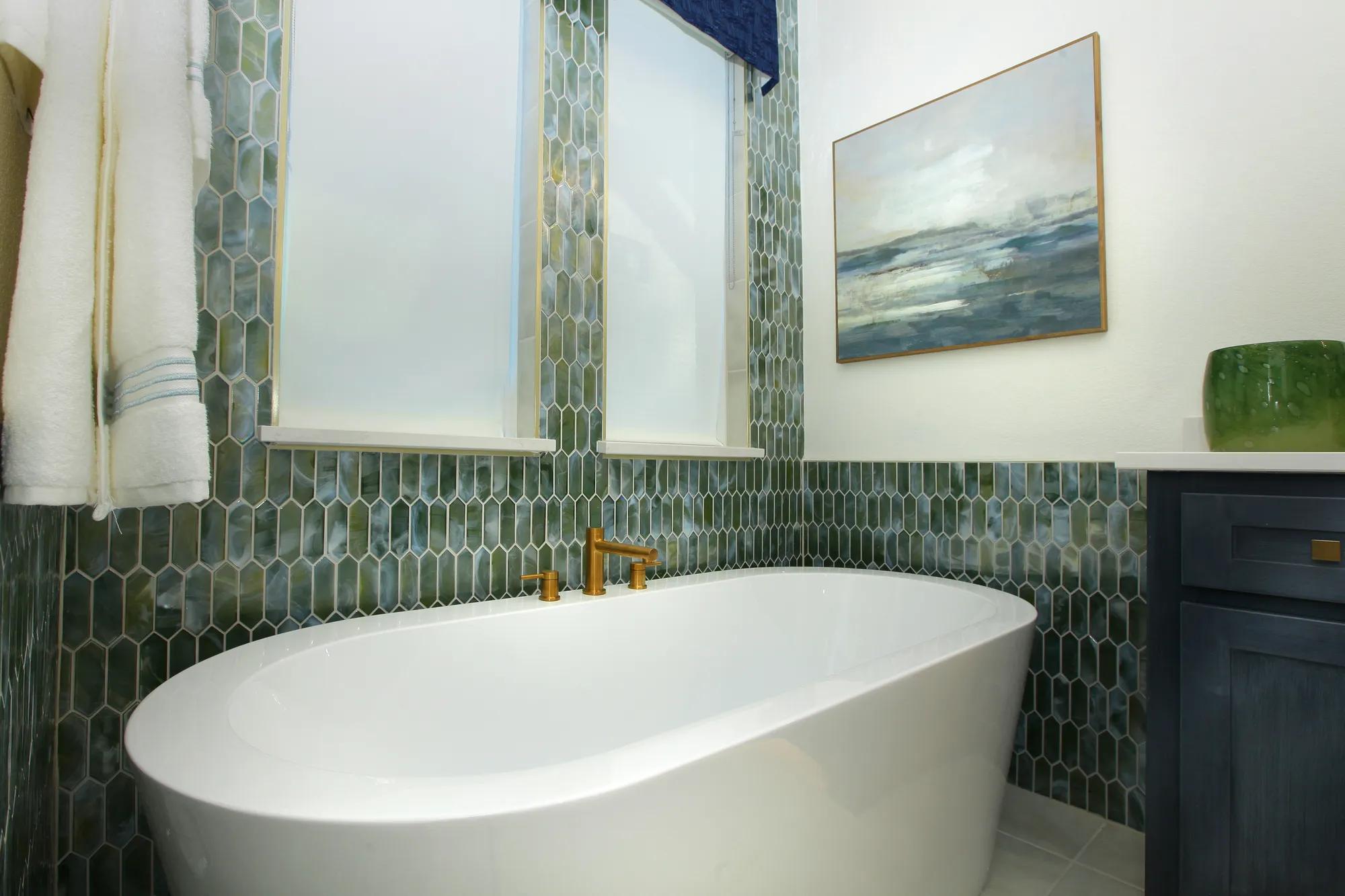 freestanding tub with brass faucet