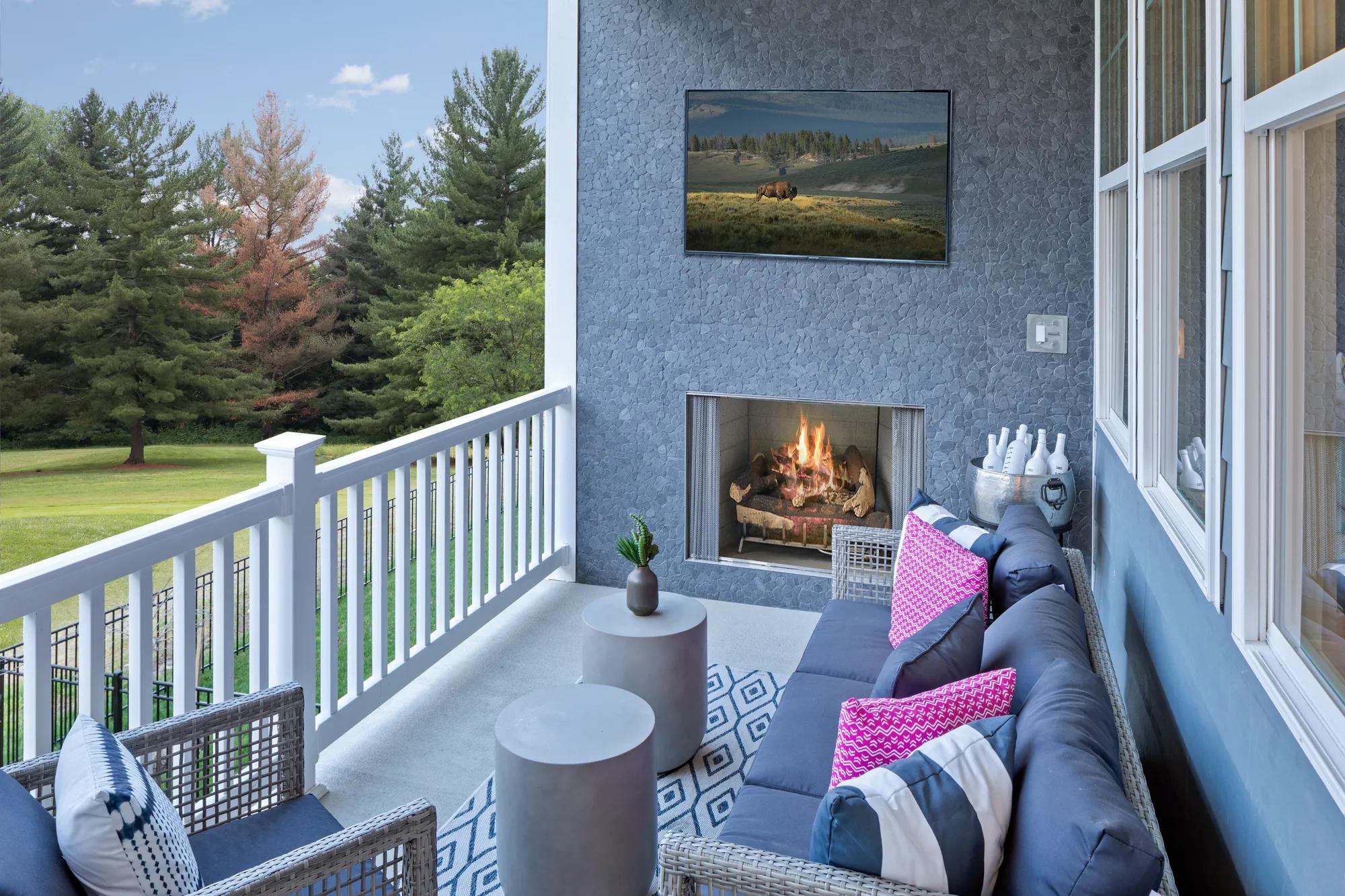 covered porch with fireplace
