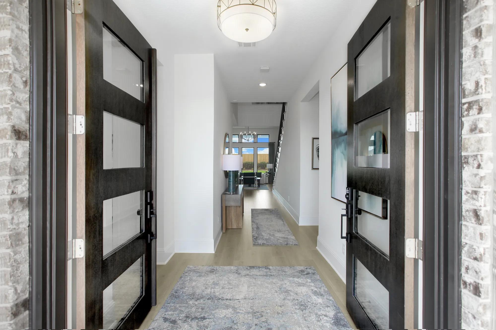 Custom home foyer entrance with double front doors