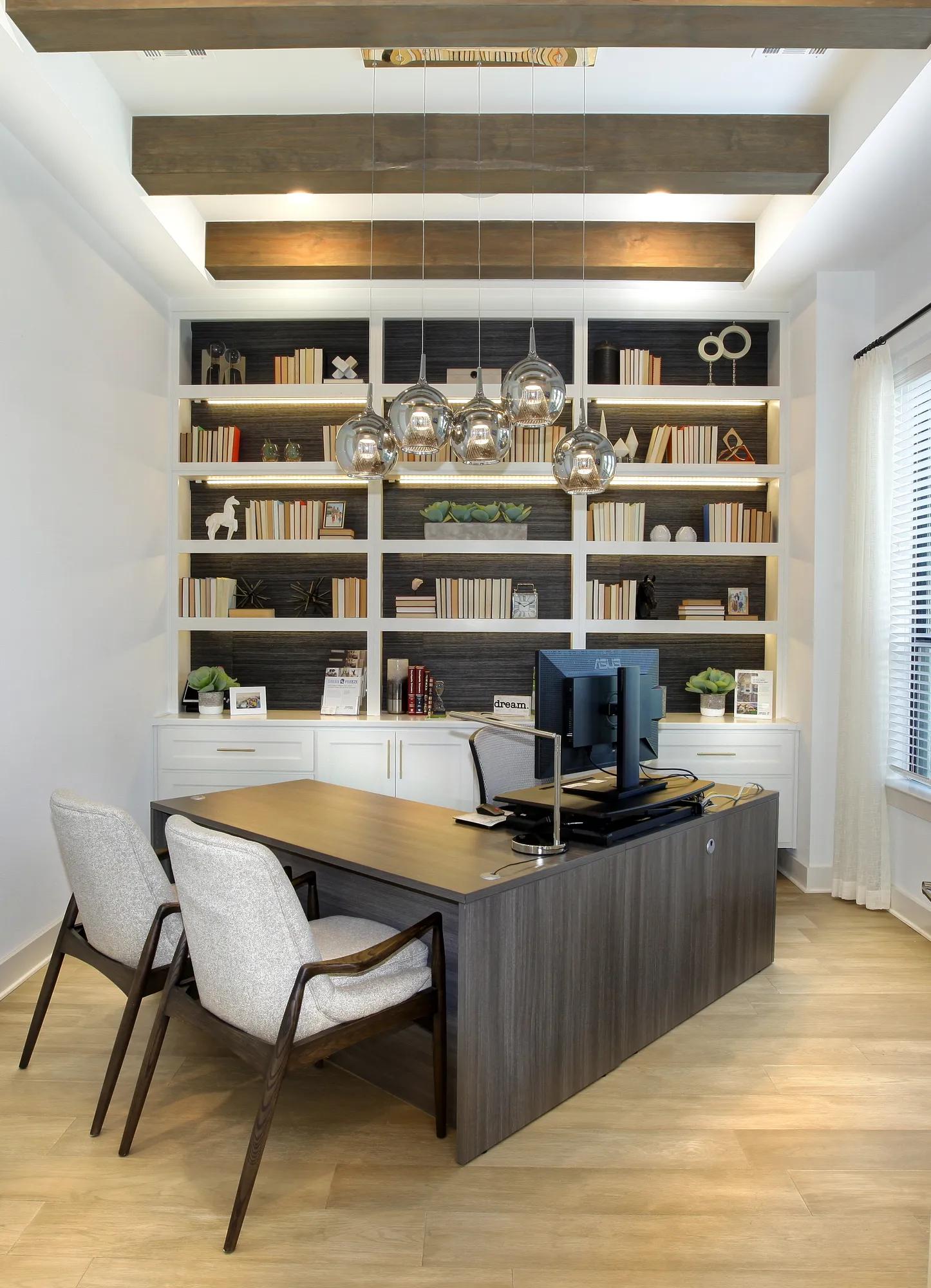 Home Office with beam ceiling and built-in shelves