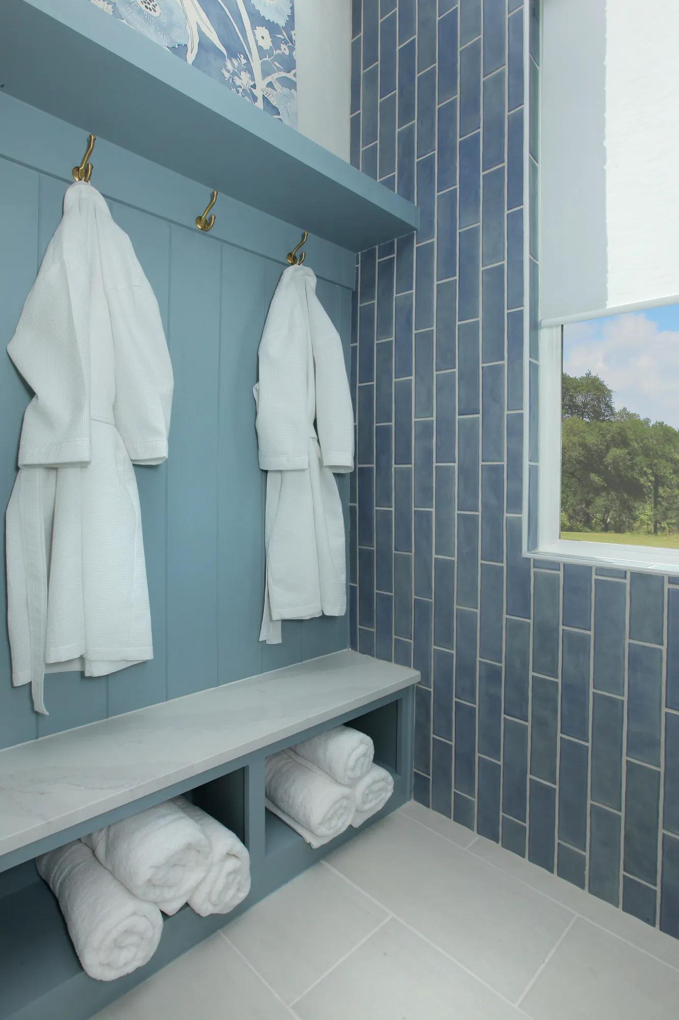 Custom home luxury primary bathroom shower storage with hooks and bench