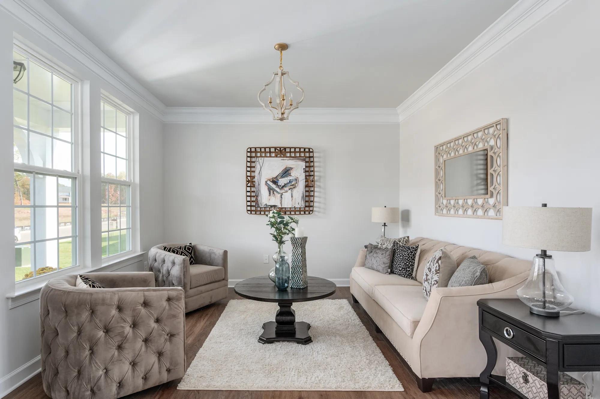 living area with sofa and chairs