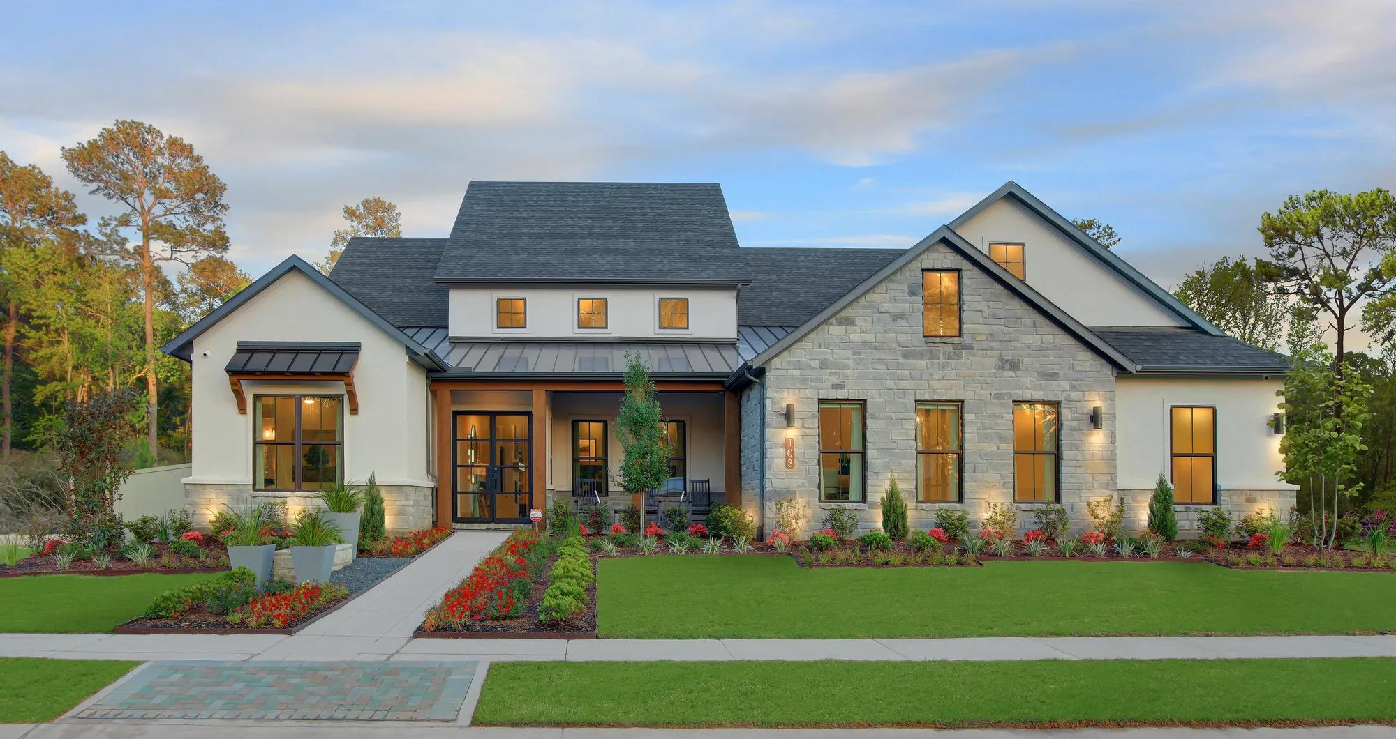 new construction Drees home with stone and stucco