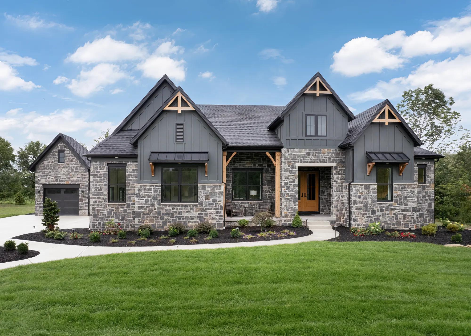 Stone and board and batten new construction home