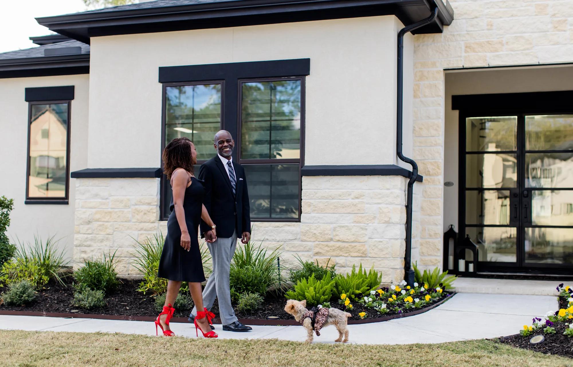 New homeowners enjoying their beautiful brick Drees Home