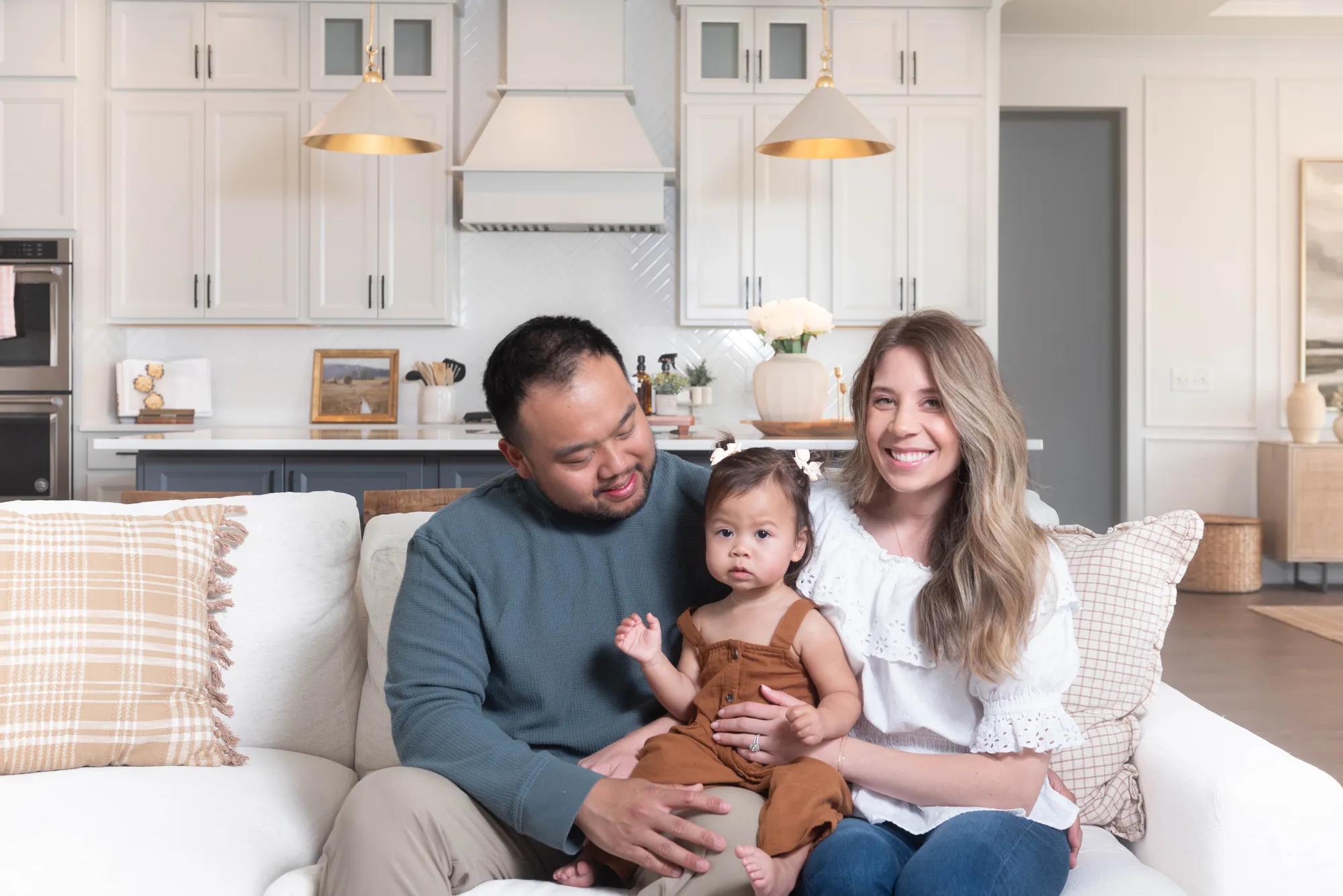 New homeowners in their Drees home family room