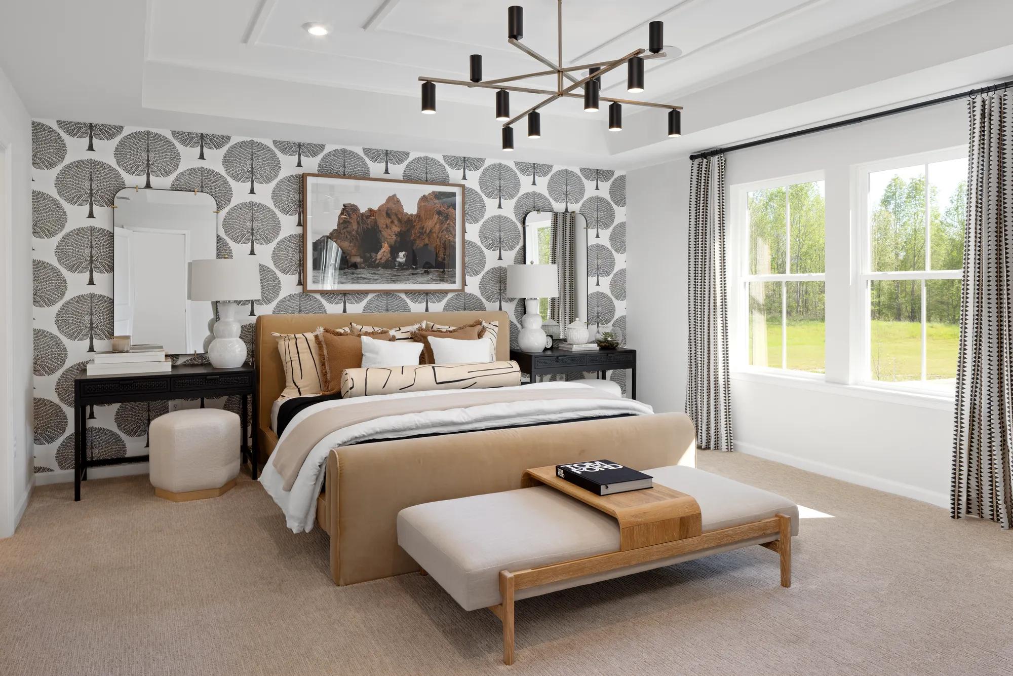 custom primary suite with tray ceiling