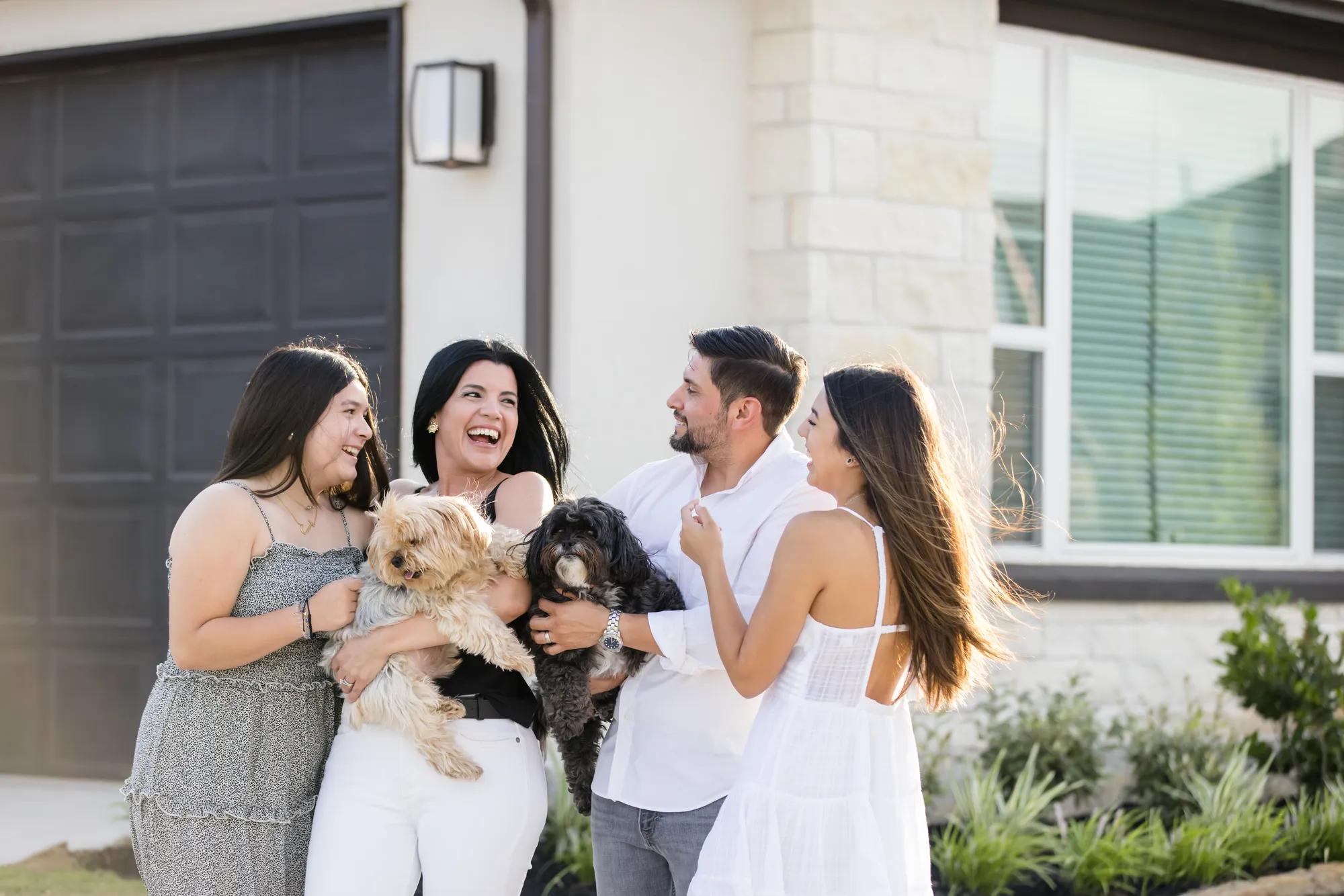 New homeowners enjoying the space in front of their beautiful Lauren style home